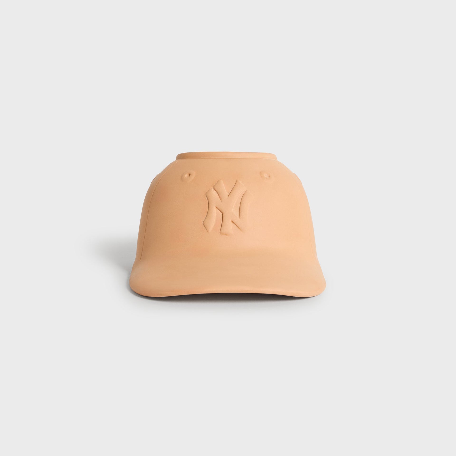 Kith for the New York Yankees terracotta cap-shaped planter, front view with embossed NY logo