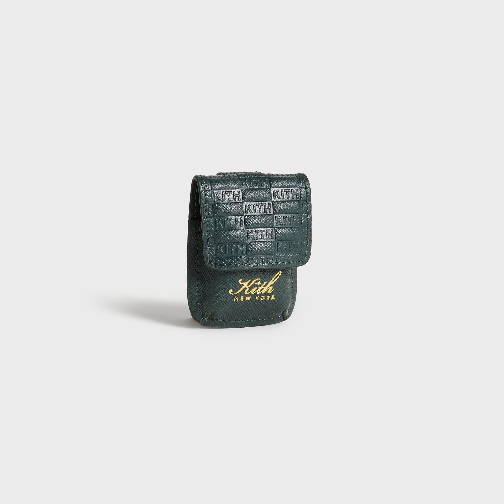 Kith Monogram Lighter Case in Stadium, three-quarter front angle highlighting embossed monogram texture