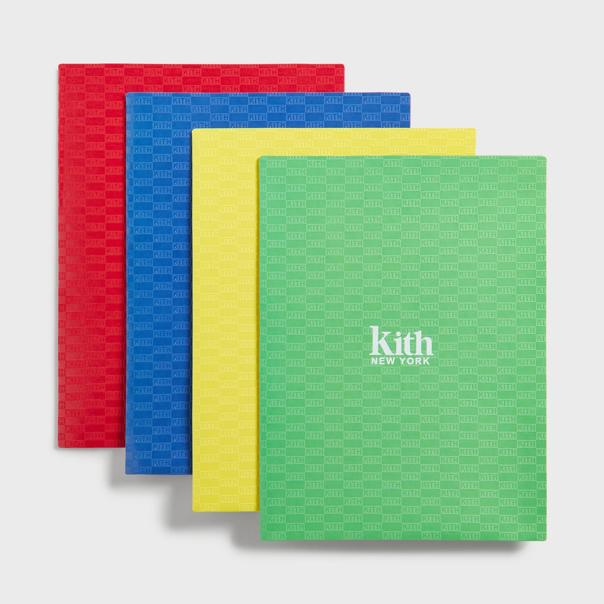 Kith Kids Back to School Set, four Kith monogram folders in red, blue, yellow and green fanned out
