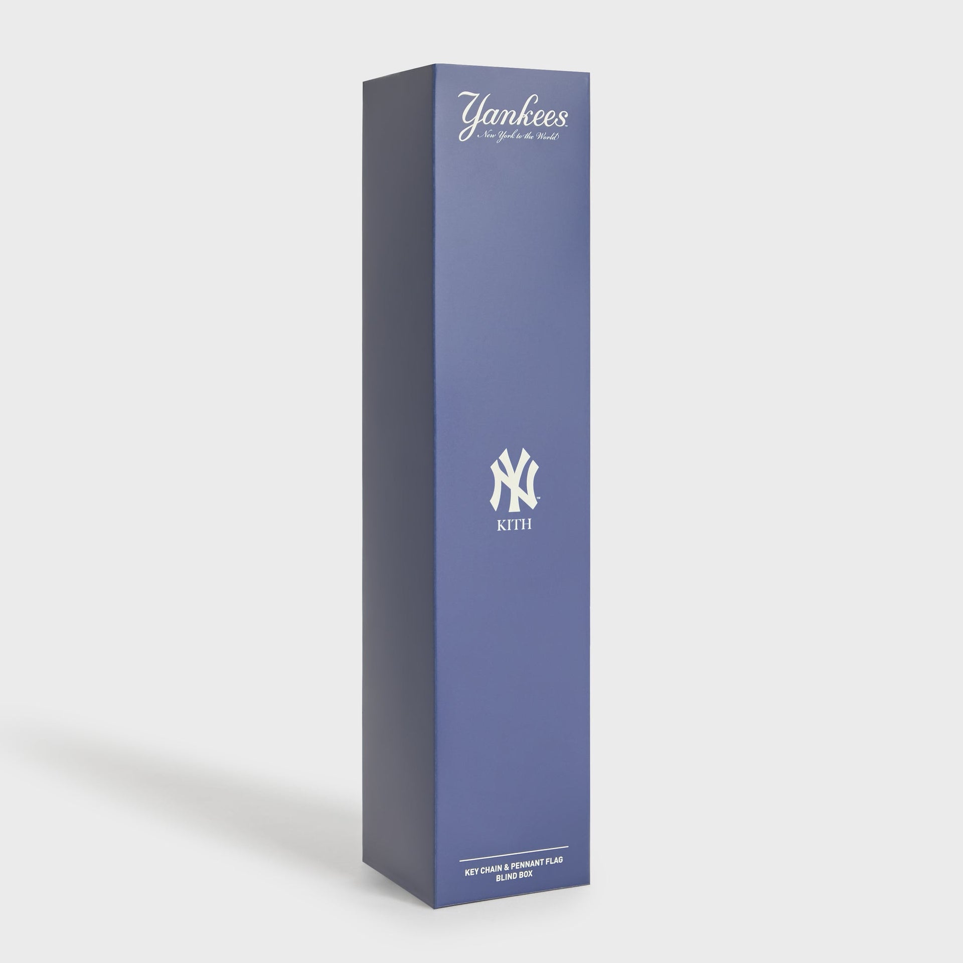 Kith for the New York Yankees keychain and pennant flag blind box packaging in navy with NY logo