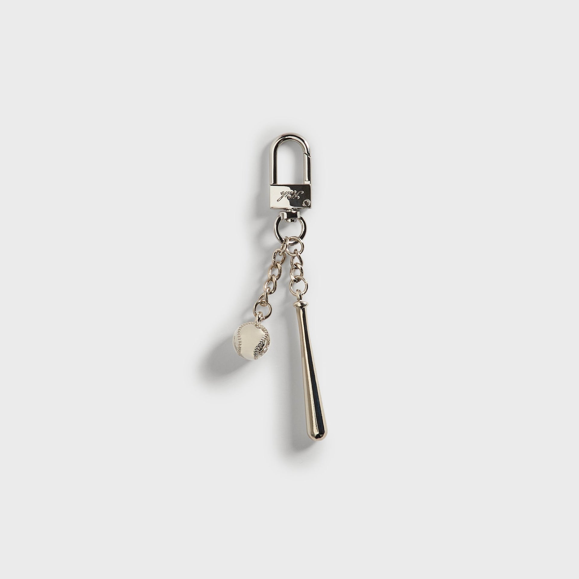 Kith x Yankees Baseball & Bat Keychain - straight-on view of clasp with bat and ball charms