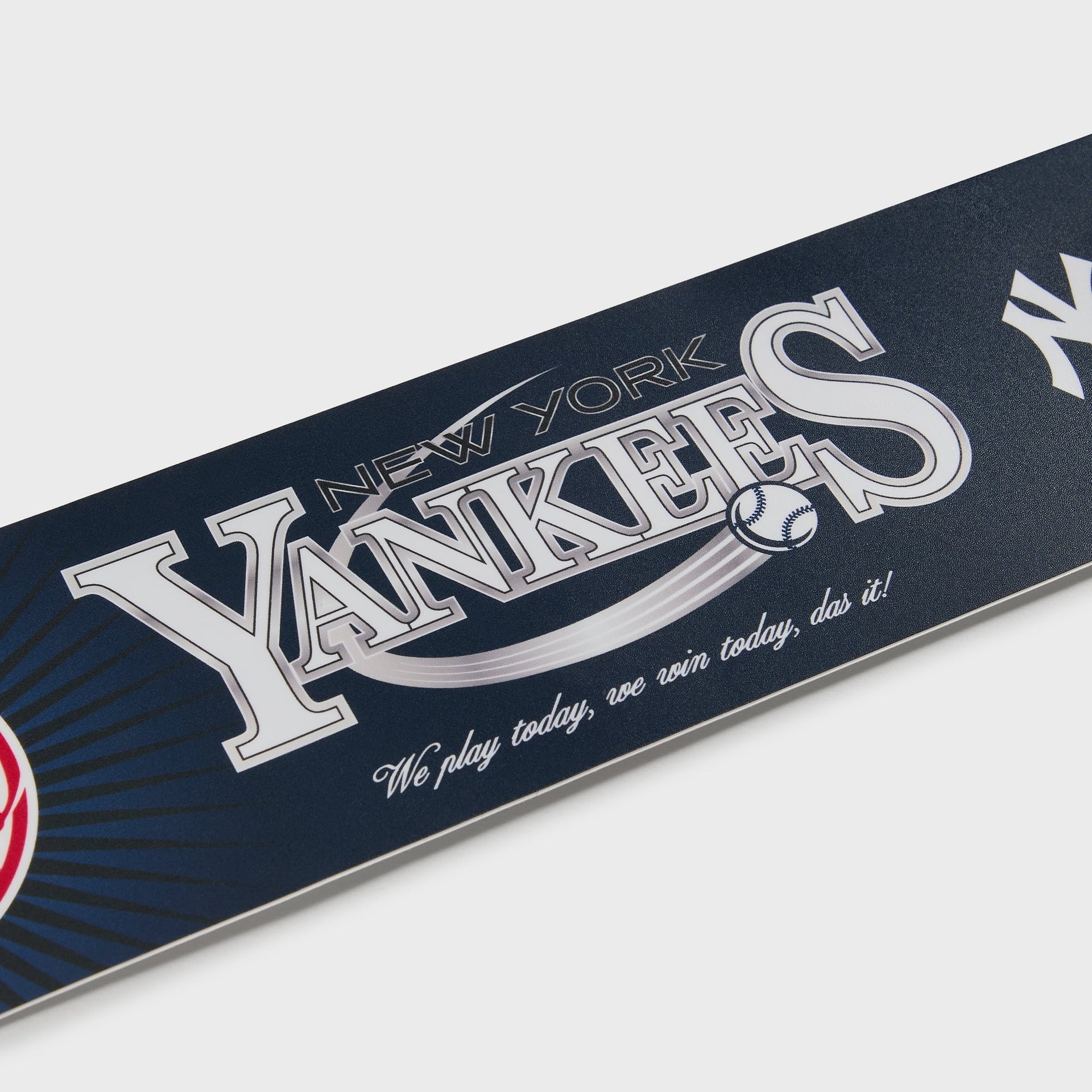 Kith for the New York Yankees bumper sticker shown at an angle, highlighting the raised silver foil lettering