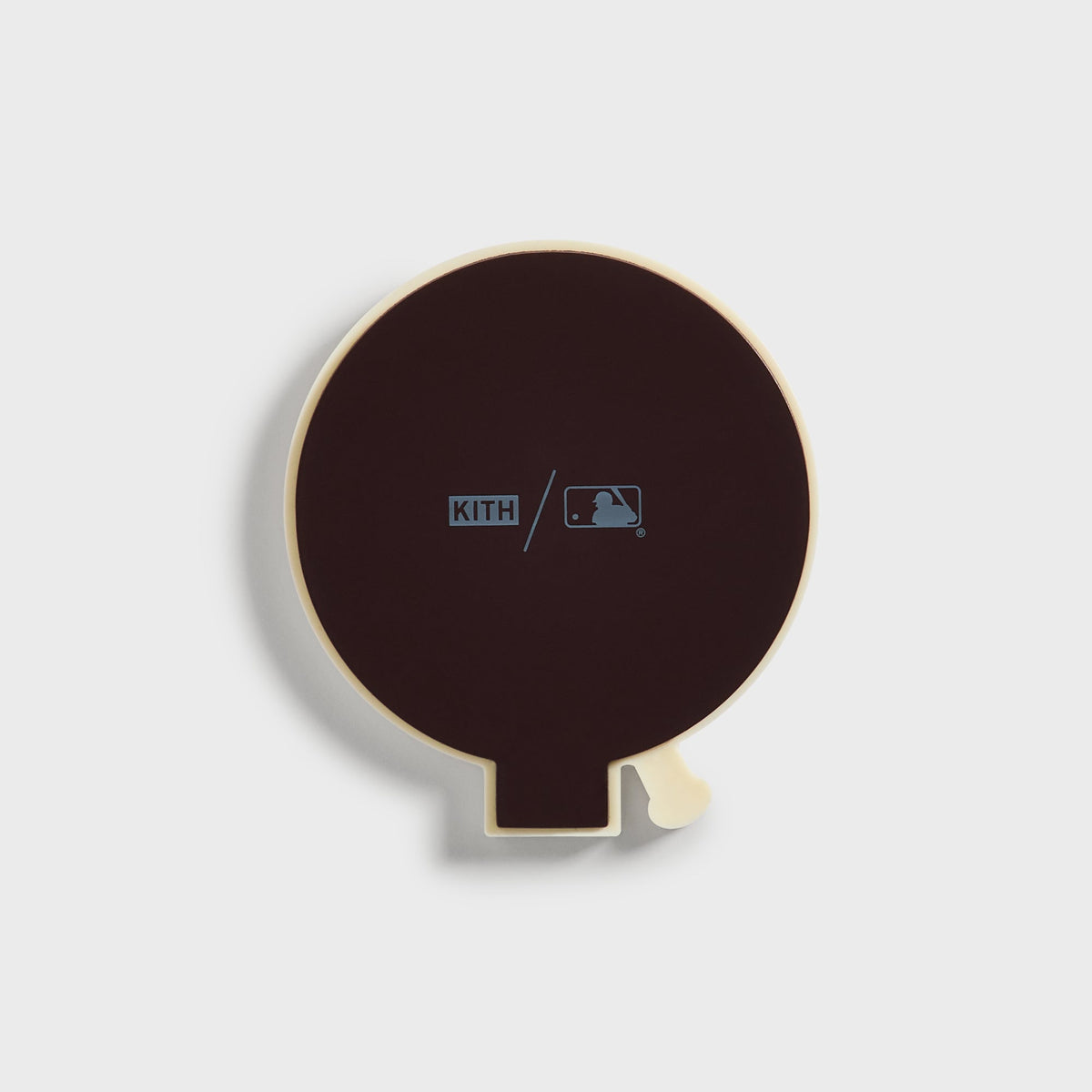 Back of the round Kith x New York Yankees baseball logo magnet showing the Kith slash MLB imprint