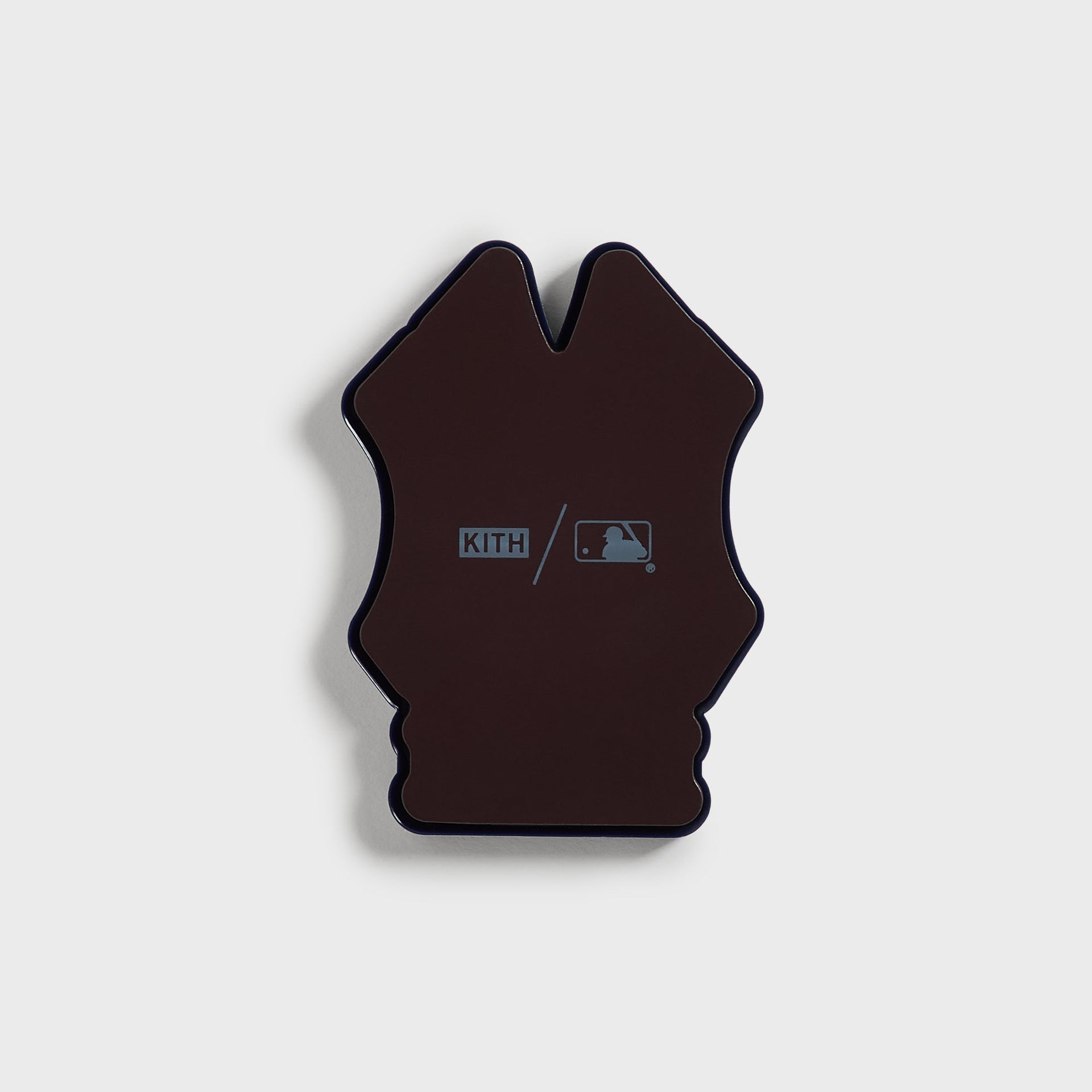 Back of the Kith x New York Yankees NY logo fridge magnet showing the Kith slash MLB imprint