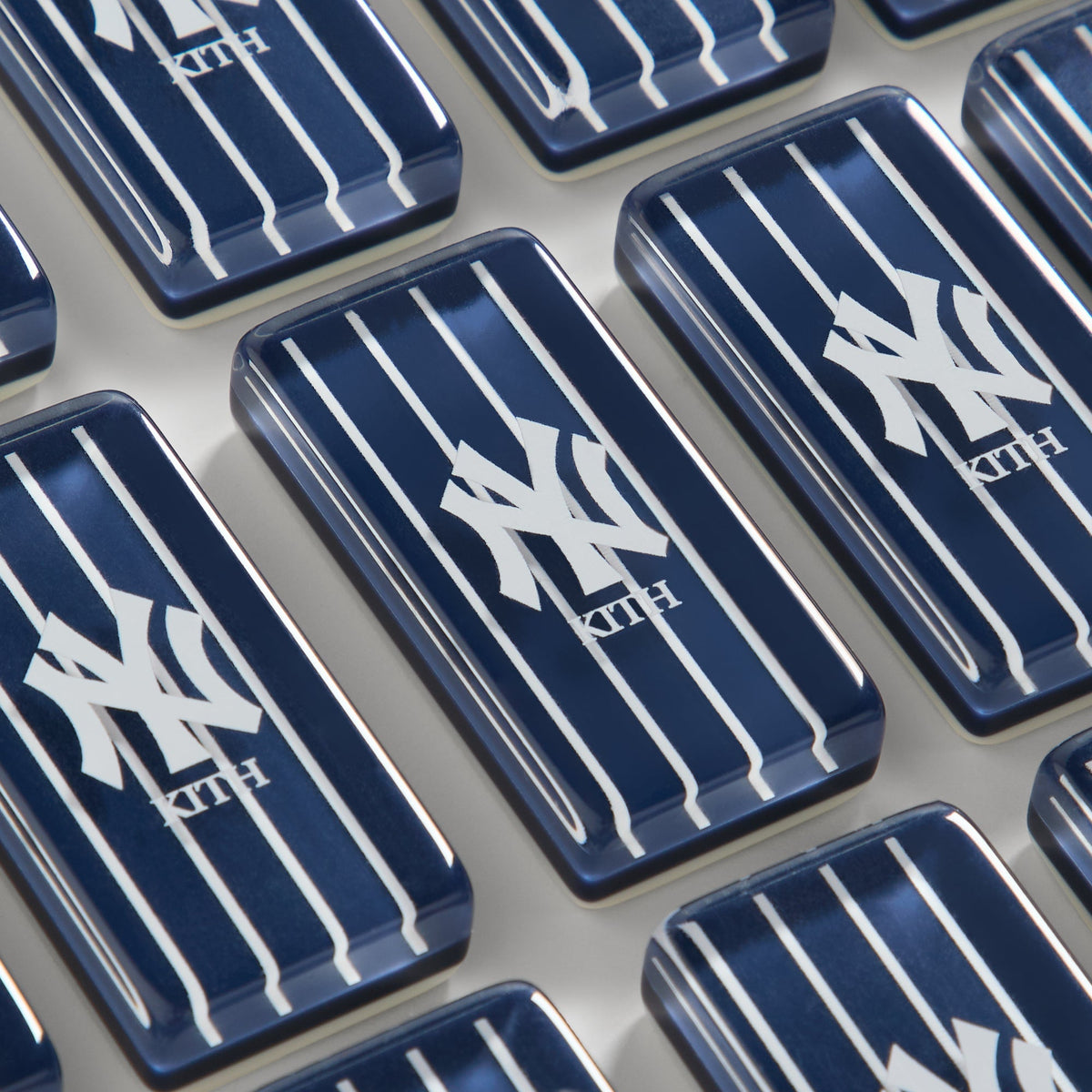 Angled close-up of Kith x New York Yankees domino tile faces showing pip dots
