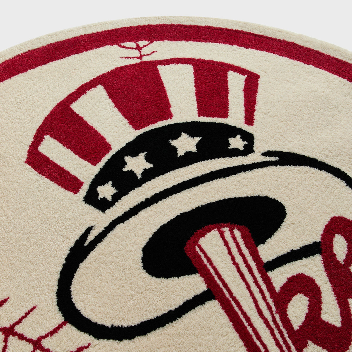 Close-up of the tufted top hat and star details on the Kith x Yankees logo rug