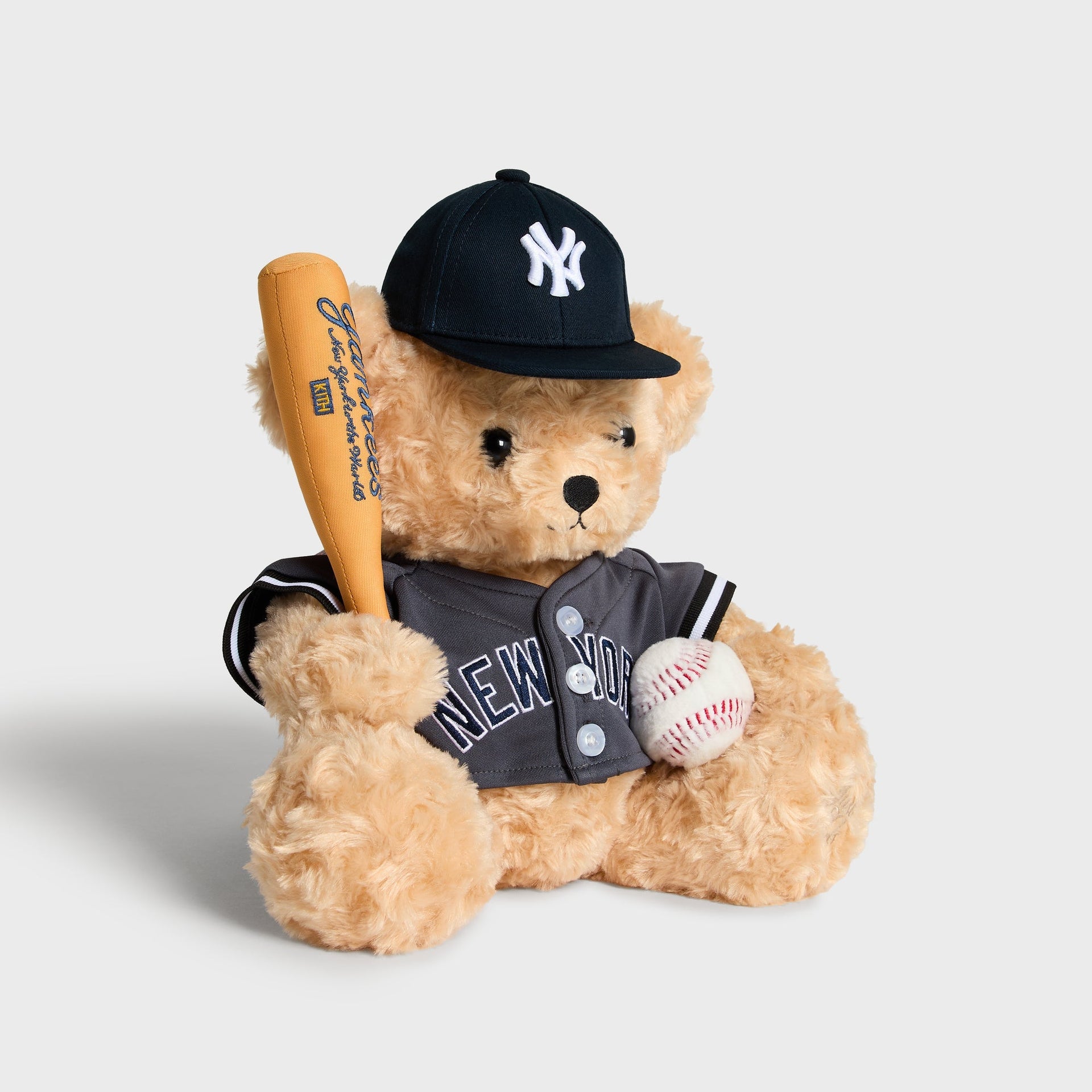 Kith x New York Yankees Teddy Bear in Skyscraper, closer front view holding bat and ball