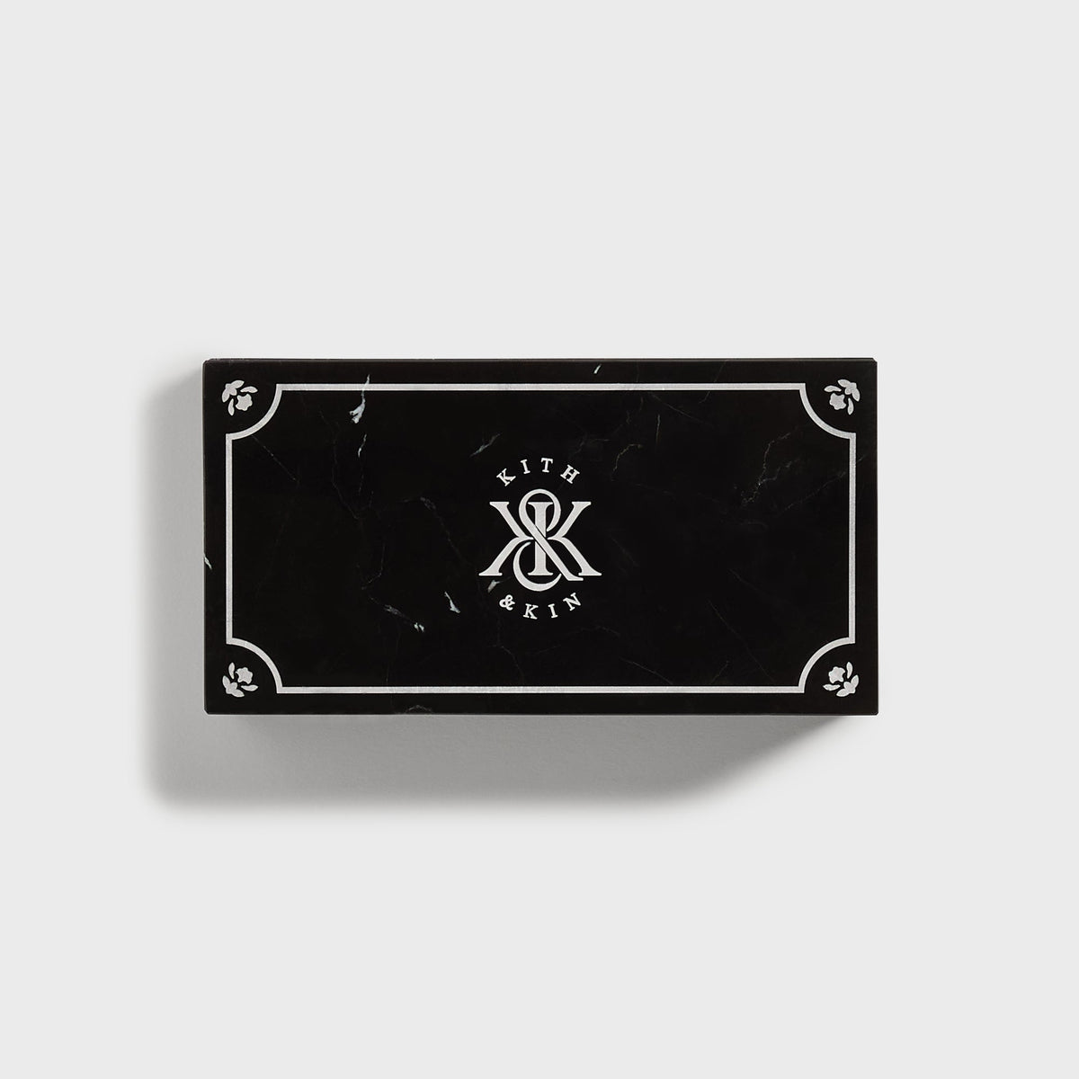 Kith Marble Box in black marble with white inlay border and Kith & Kin logo on lid, top view