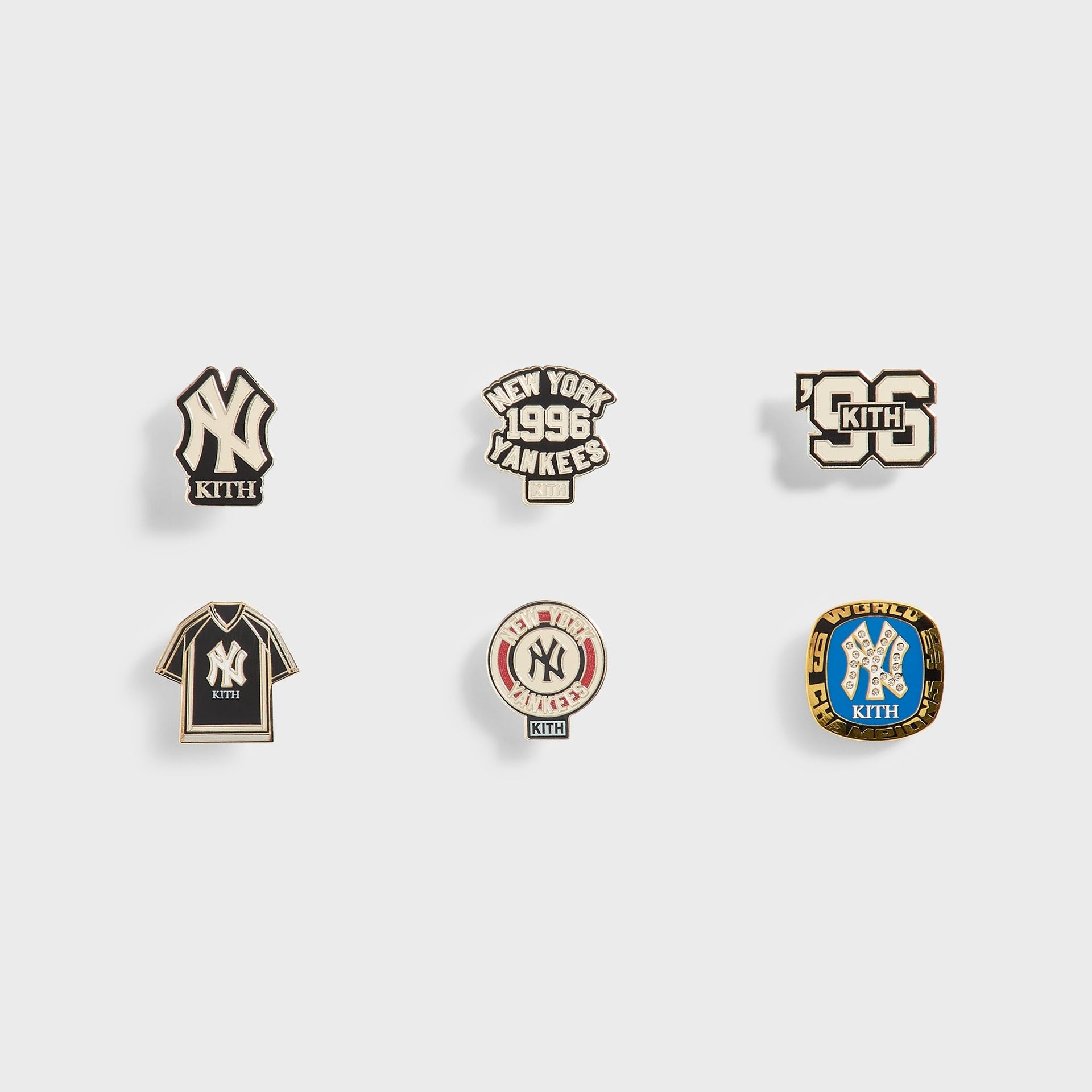 Kith x New York Yankees enamel pin set, front view of all six pins laid flat