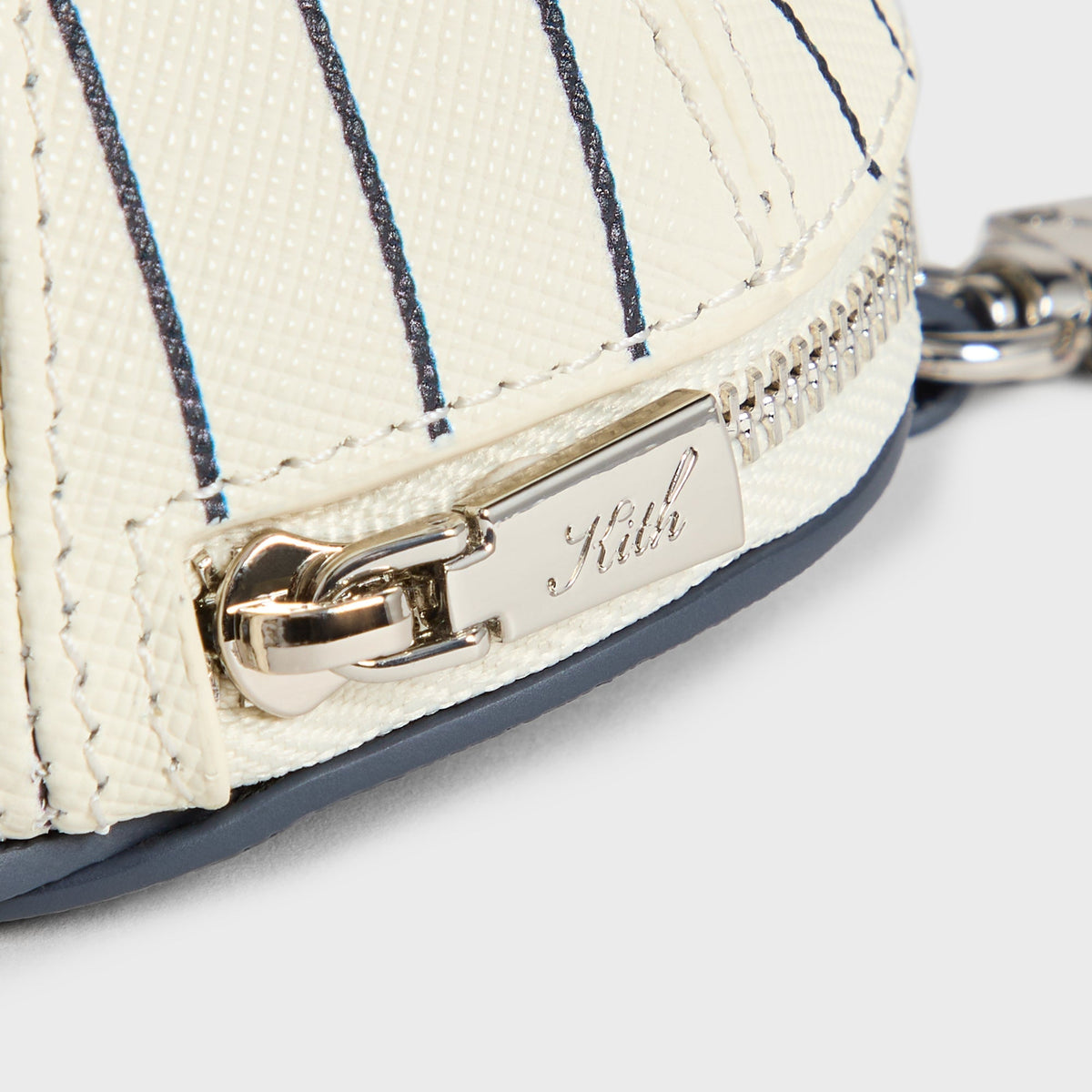 Kith x Yankees Baseball Cap Leather Pouch, Sandrift - close-up detail of zipper pull and Kith-engraved hardware