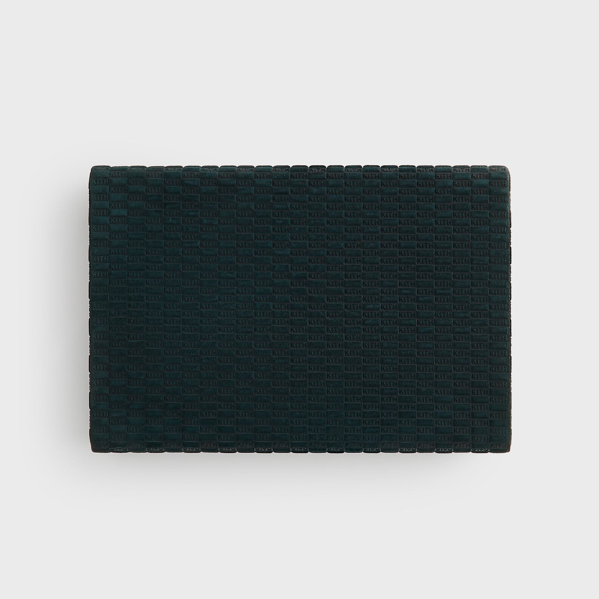 Closed Kith Poker Set from above, rectangular Stadium green suede with allover debossed KITH checkerboard monogram