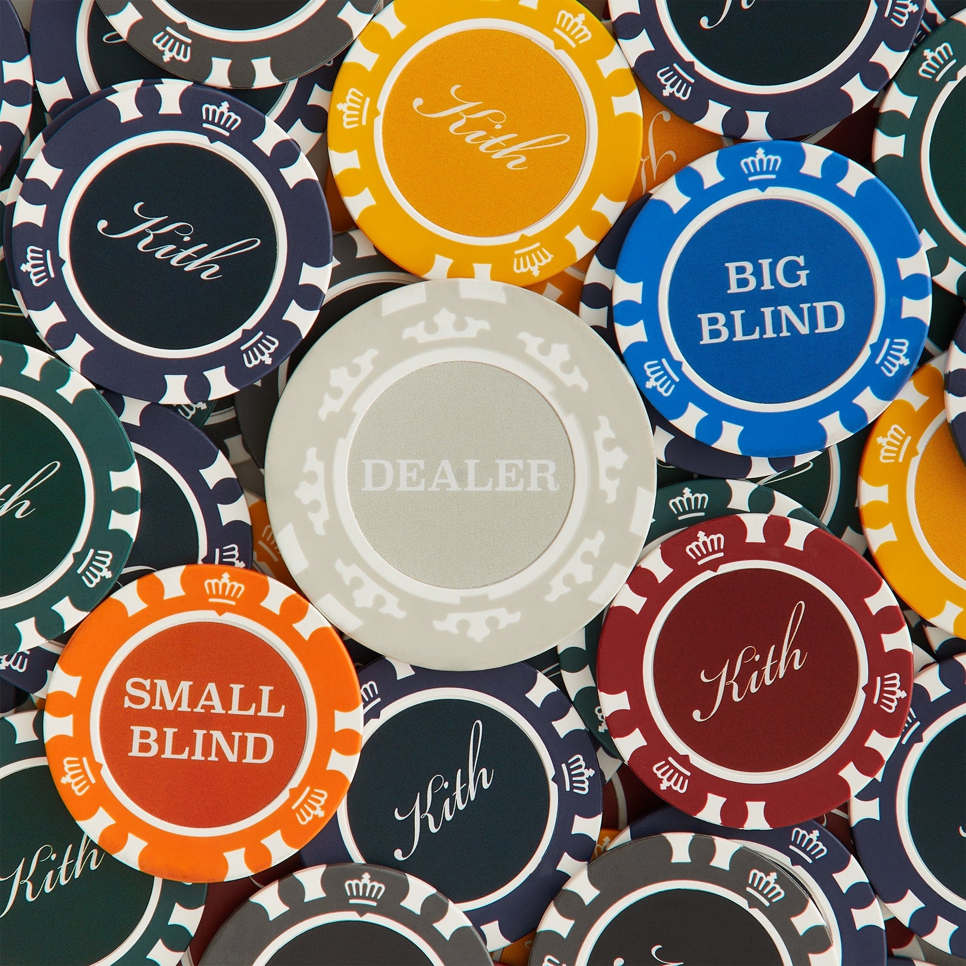 Kith poker chips spread out showing Dealer, Big Blind and Small Blind buttons and crown-rim Kith chips in many colors