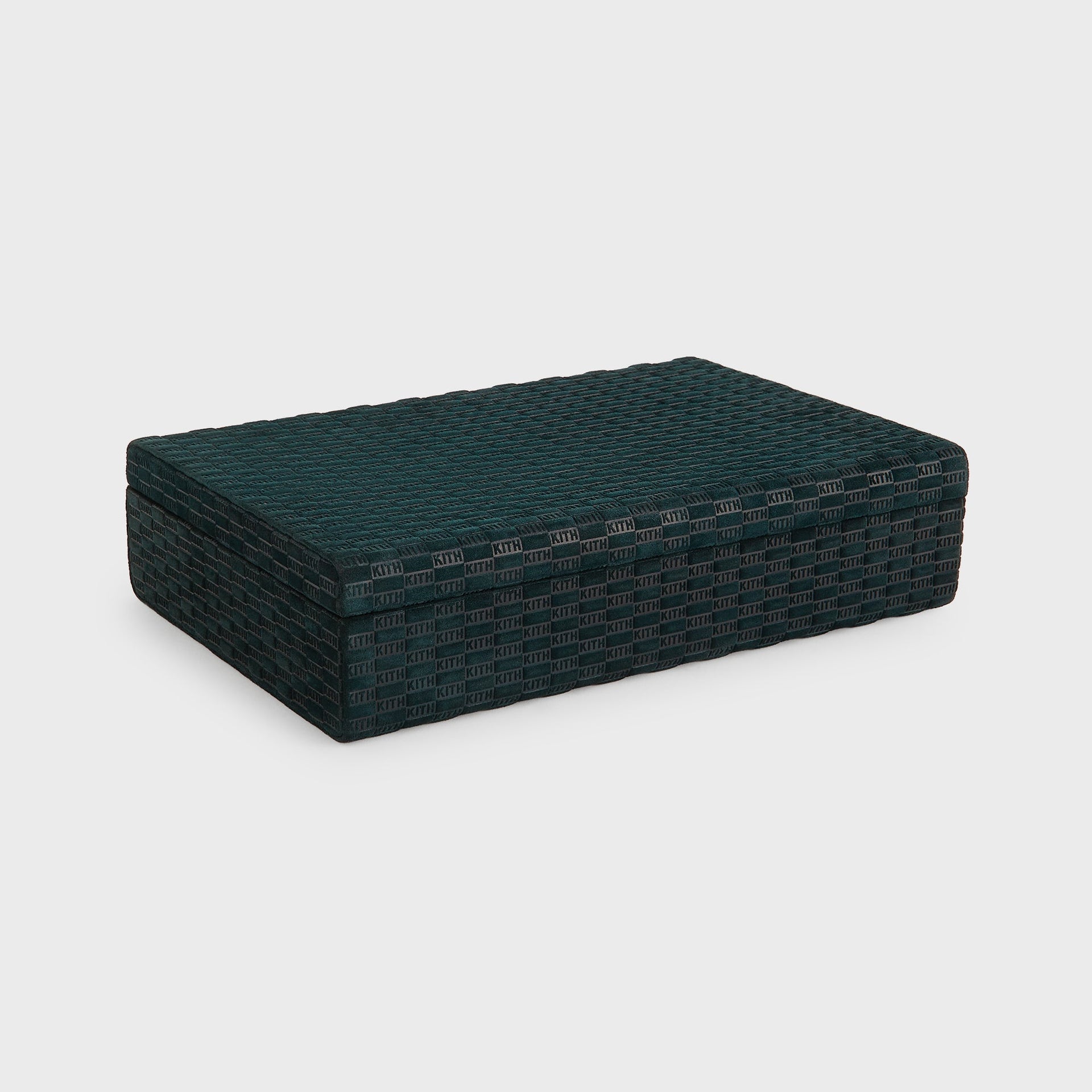 Closed Kith Poker Set case at an angle, Stadium green suede with allover embossed KITH monogram and rounded edges