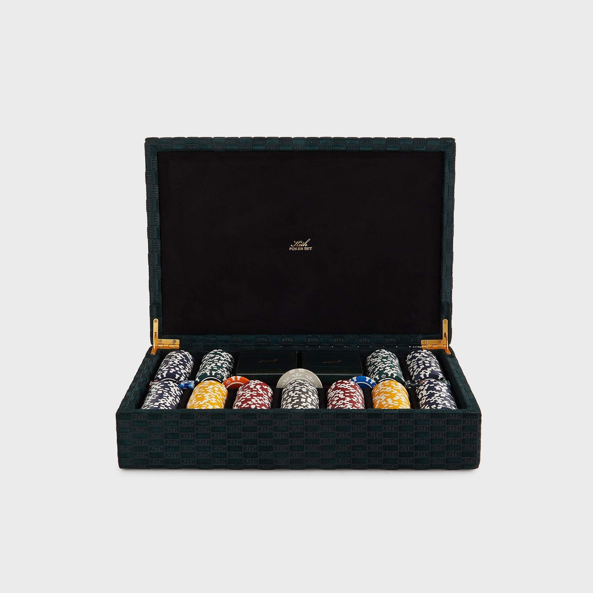 Kith Poker Set open in its Stadium green KITH-monogram suede case with chip stacks, two Kith card decks and marbled dice