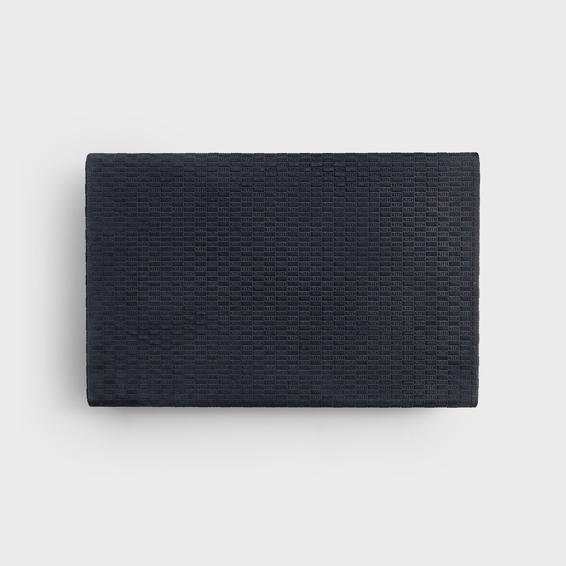 Kith Monogram backgammon set closed flat, rectangular ink suede case with allover debossed KITH monogram, top view