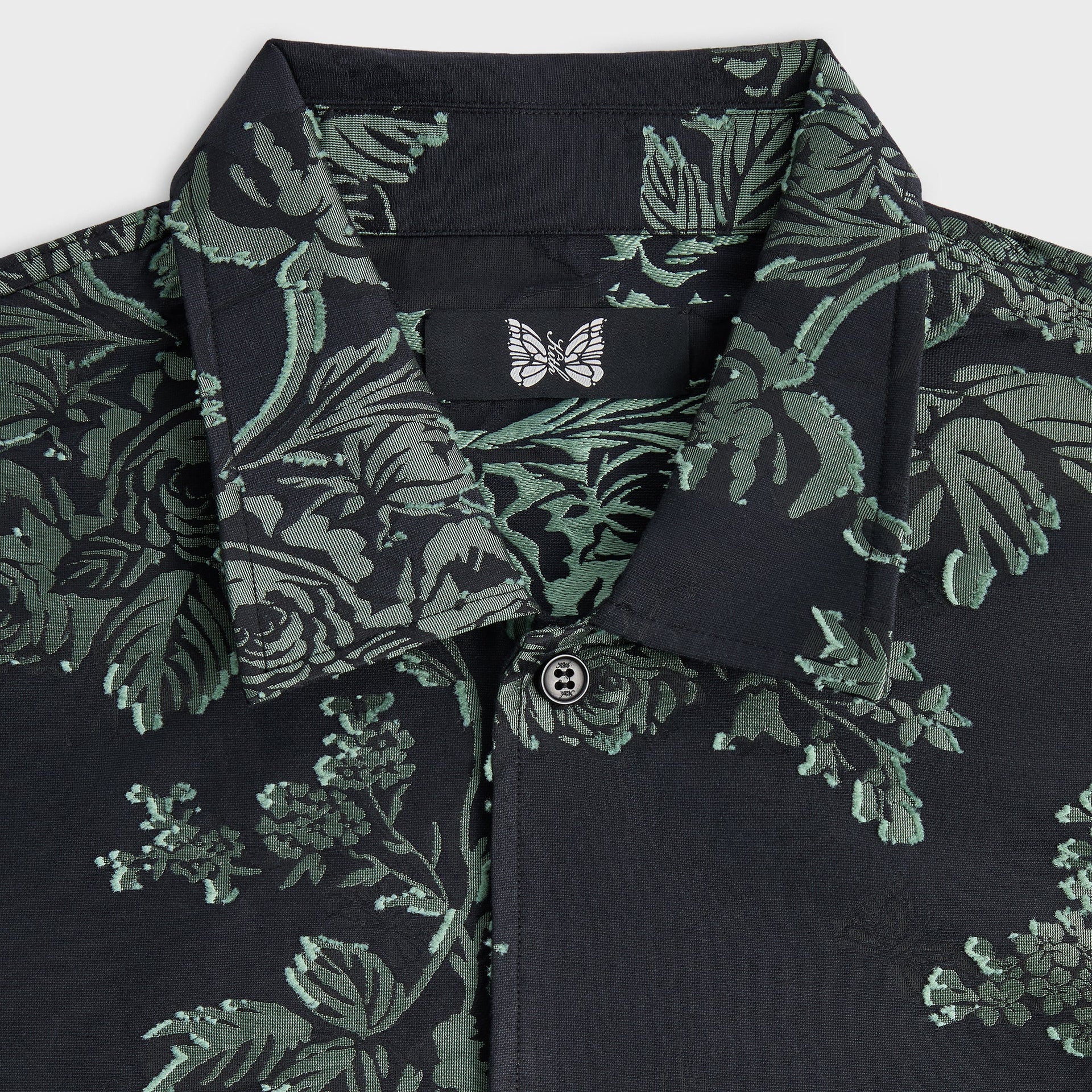 Close-up of the collar and small butterfly embroidery patch on the Kith for Needles BCO shirt