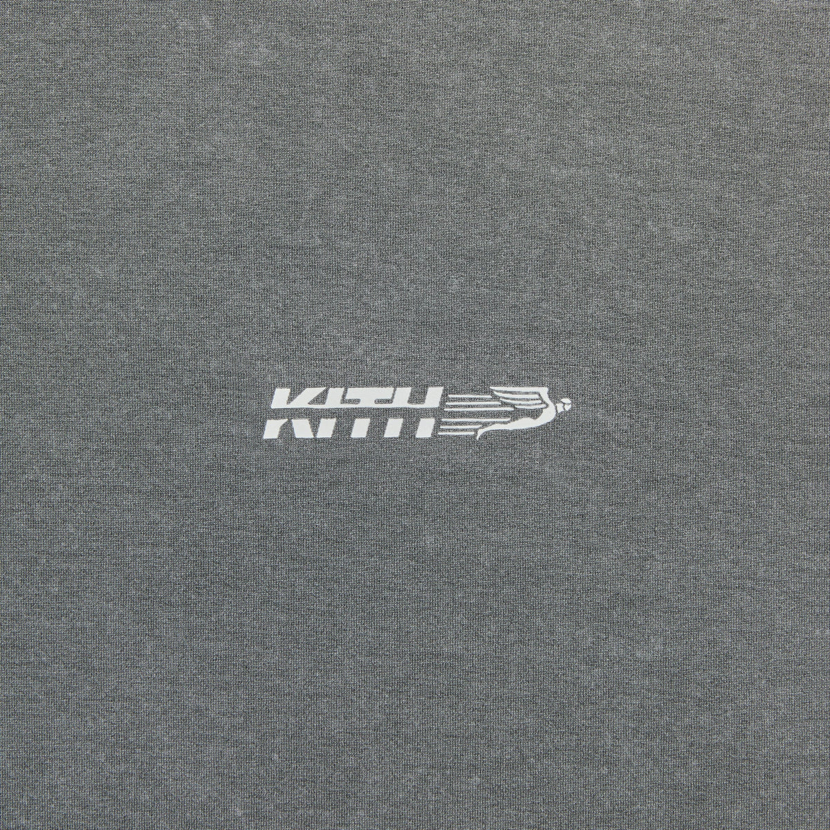 Close-up of Kith Garment-Dyed Heathrow Tee chest logo, small KTECH Kith wing emblem