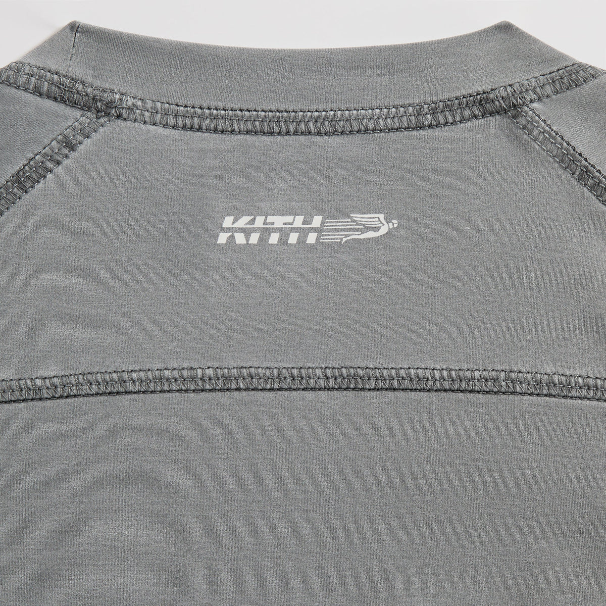 Close-up of Kith Garment-Dyed Paneled Donovan Tee sleeve seam with contrast paneling