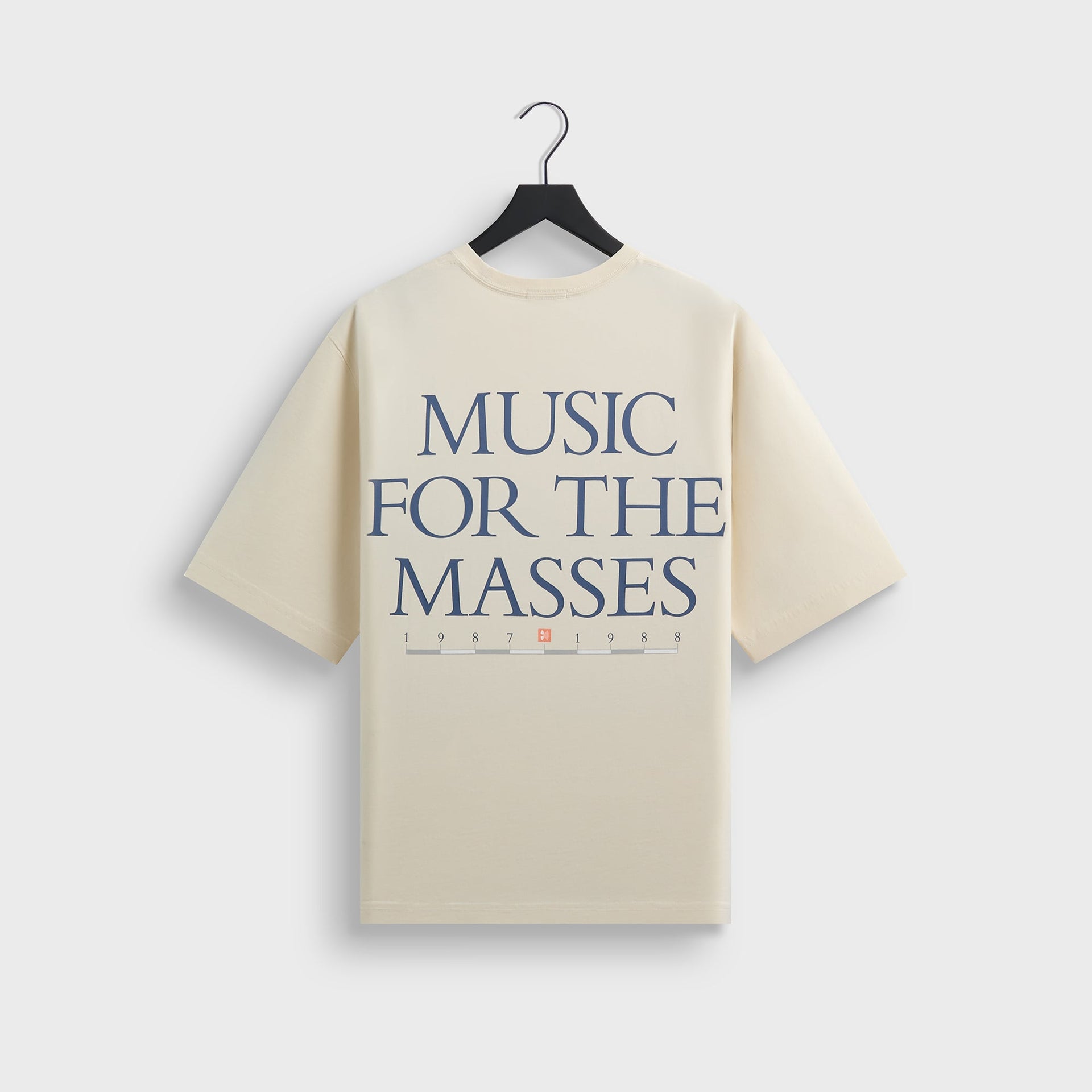 Kith for Depeche Mode Vintage Alex Tee in cream Sandrift, back view with Music For The Masses print on hanger