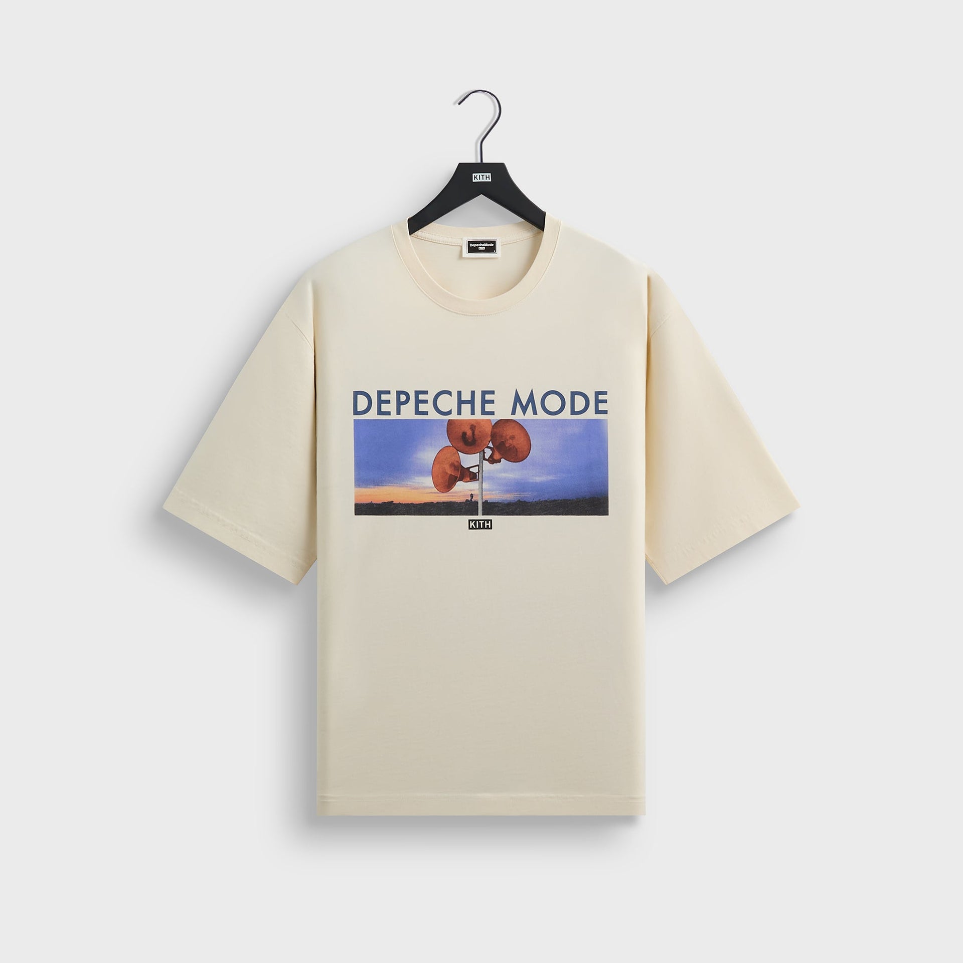 Kith for Depeche Mode Vintage Alex Tee in cream Sandrift, front view with loudspeaker album-art graphic on hanger