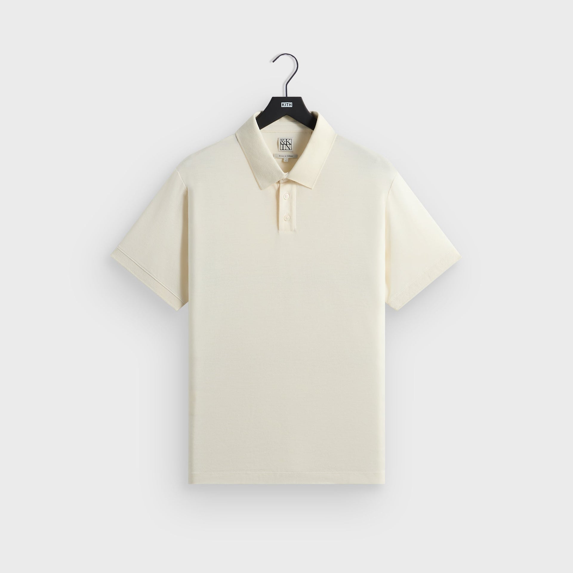 &Kin Melton Polo in White, front view on hanger with ribbed collar and two-button placket
