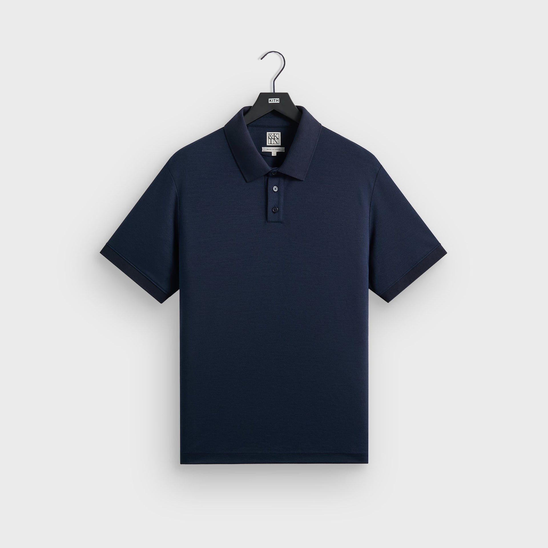 &Kin Melton Polo in Nocturnal navy, front view on hanger, ribbed collar and cuffs with three-button placket