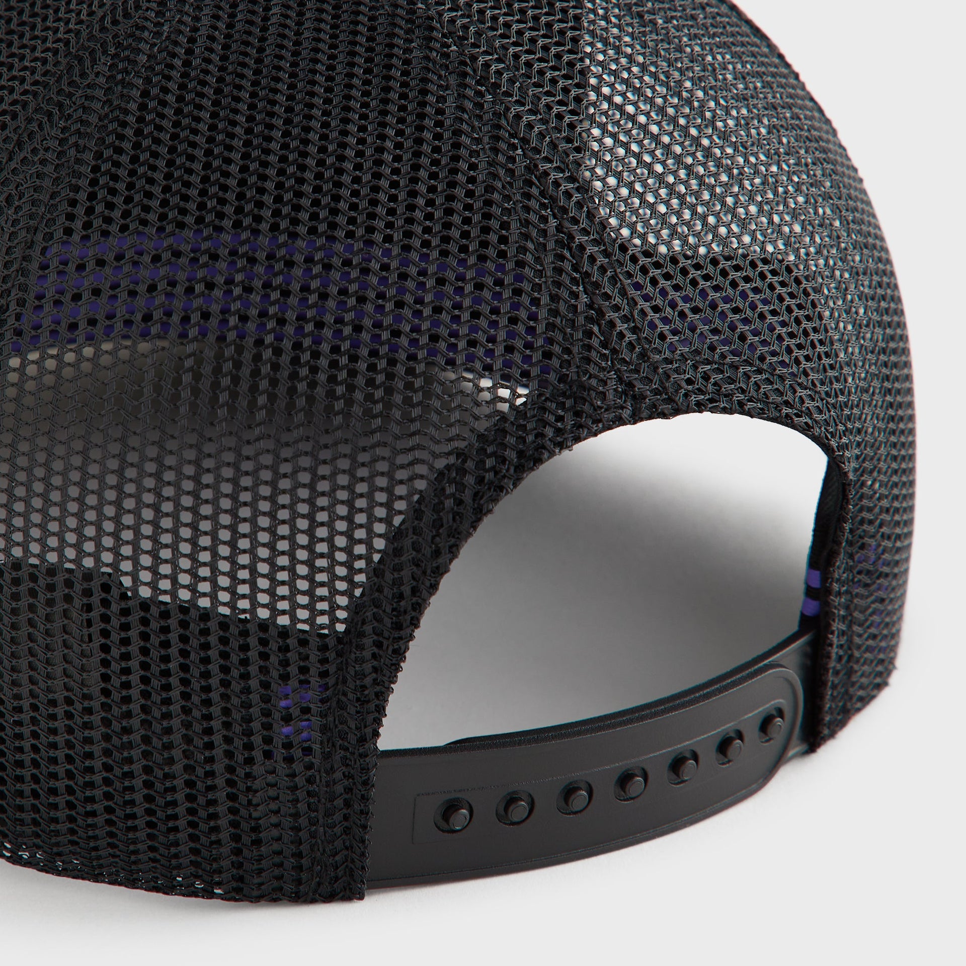 Close-up of the mesh back panel and snap closure on the Kith for Needles Velour Nolan trucker cap