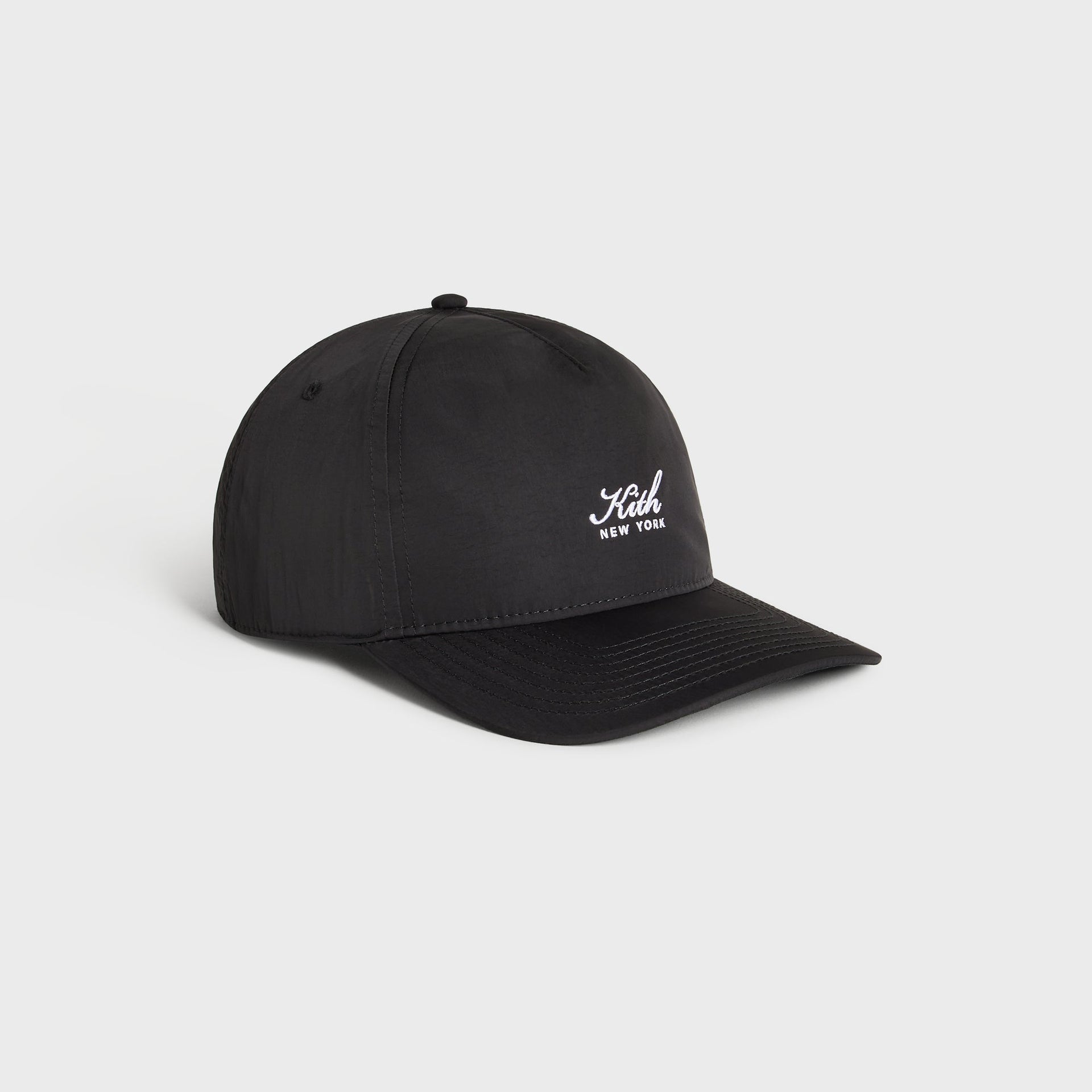 Kith Script Wrinkle Nylon Bay low pinch crown snapback in black, side profile view