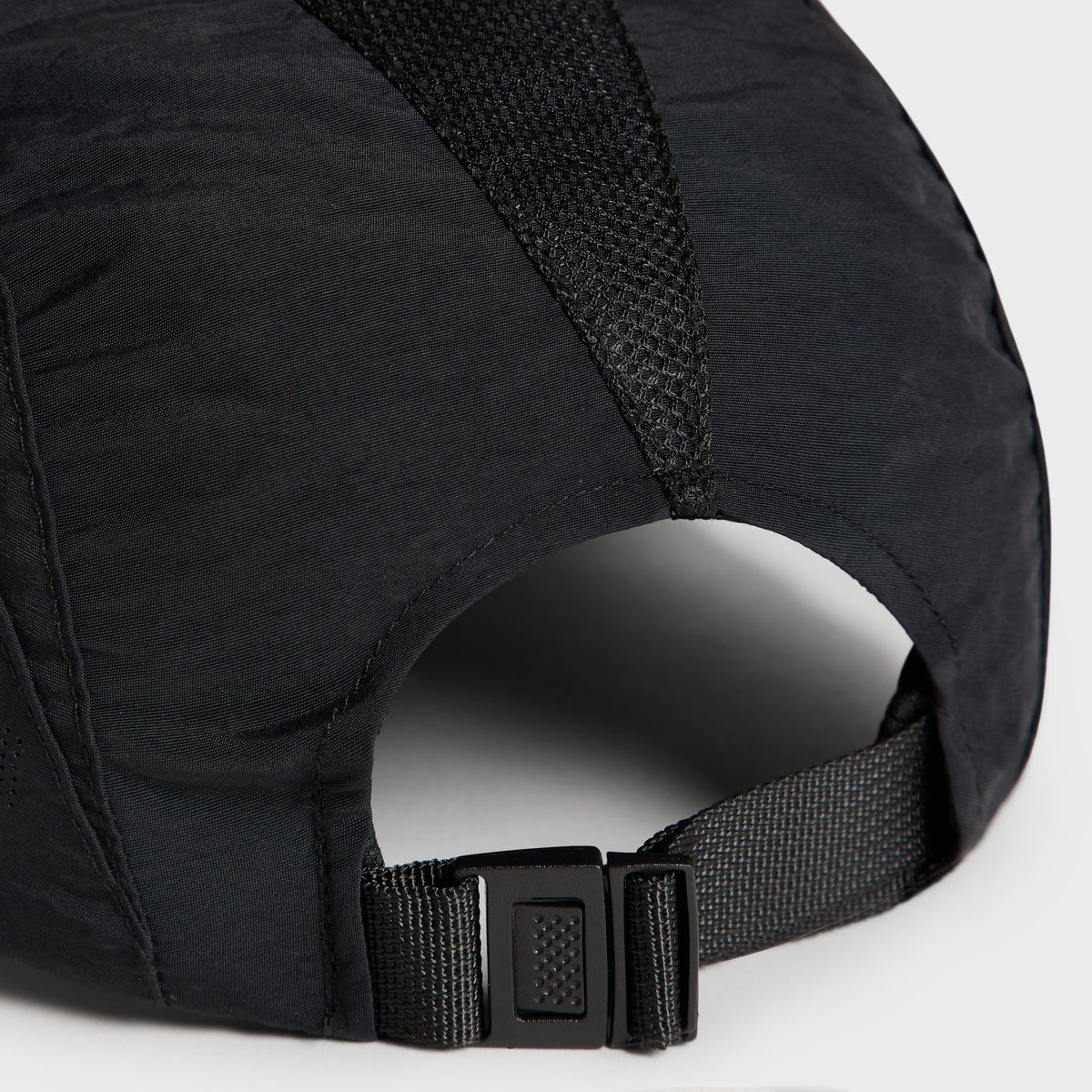 Close-up of the black adjustable strap buckle on the back of the Griffey Camper Hat