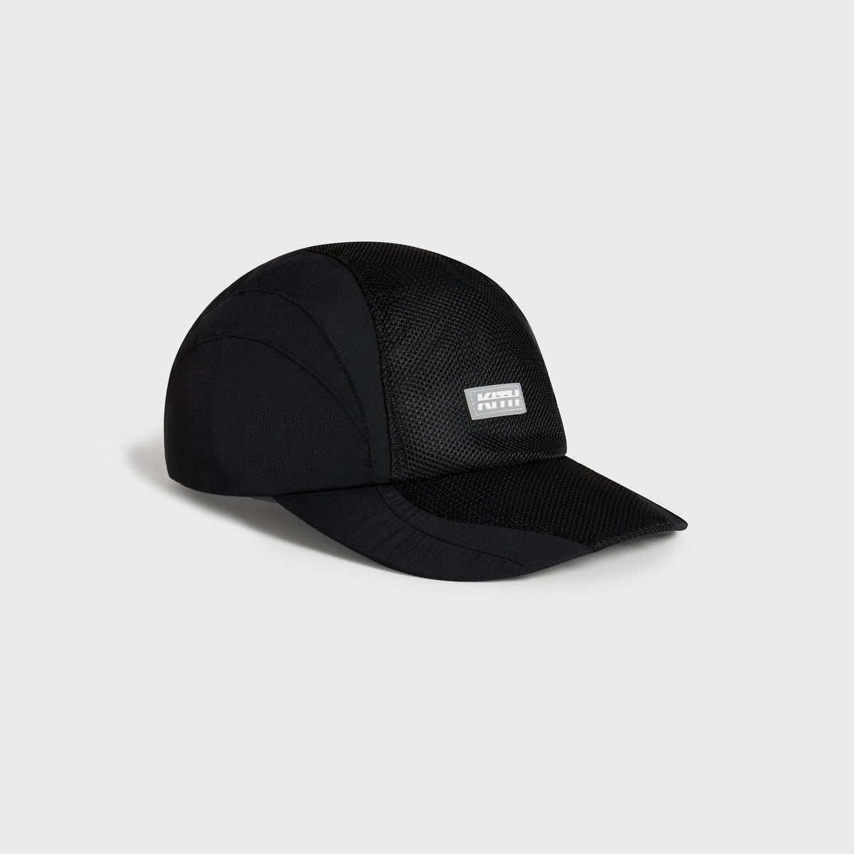Kith Nylon Mesh Paneled Griffey Camper Hat in black, three-quarter angle showing nylon and mesh paneling