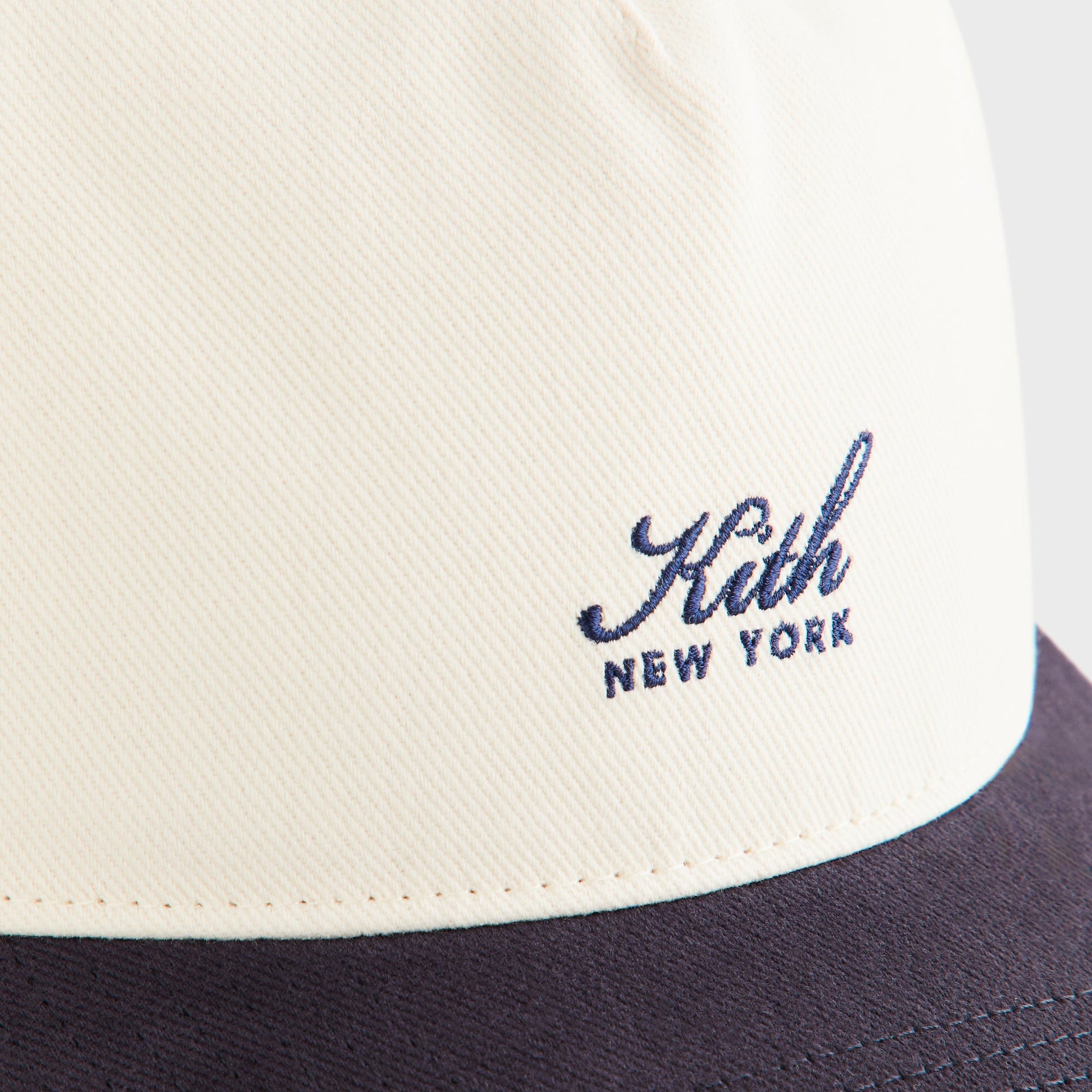Kith Script Brushed Twill Bay Low Pinch Crown Cap in Nocturnal, close-up of embroidered Kith New York logo