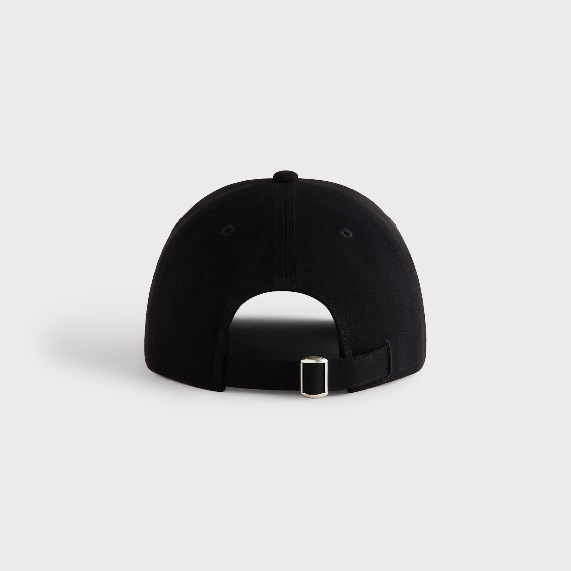 Back view of Kith Autograph Brushed Twill Bay Low Pinch Crown Cap in black showing adjustable strap and metal buckle closure