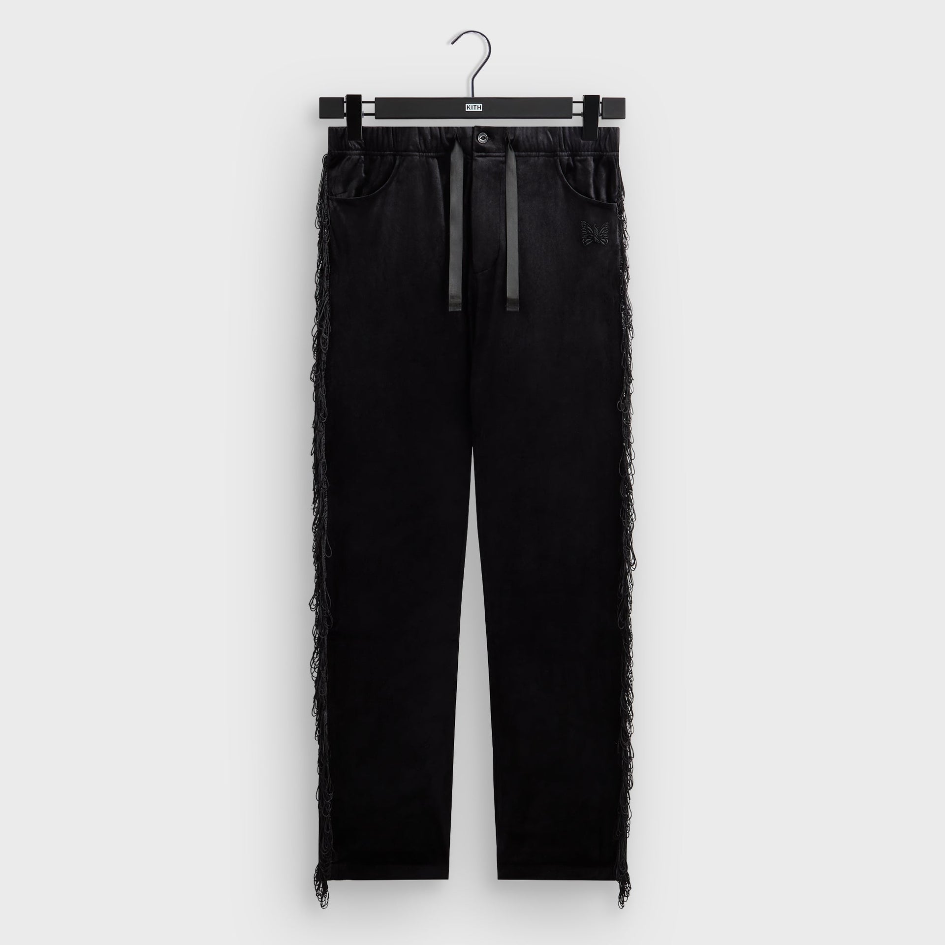 Kith for Needles Ronan fringe pant in black velour with fringe side seam trim, front flat lay