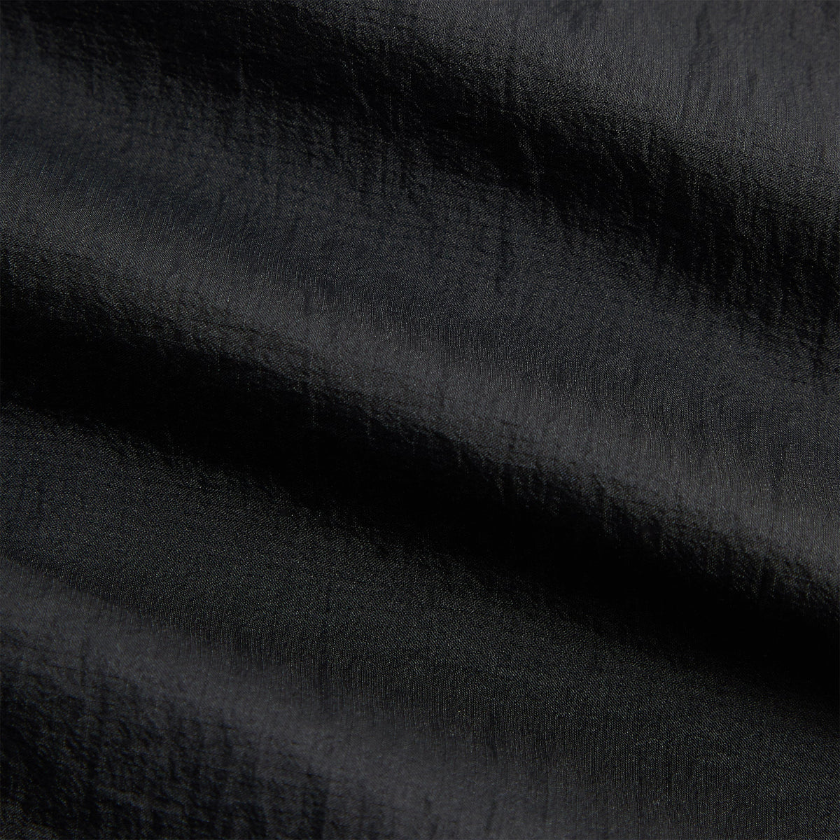 Close-up of Kith Ceres 3-inch Short black stretch fabric texture