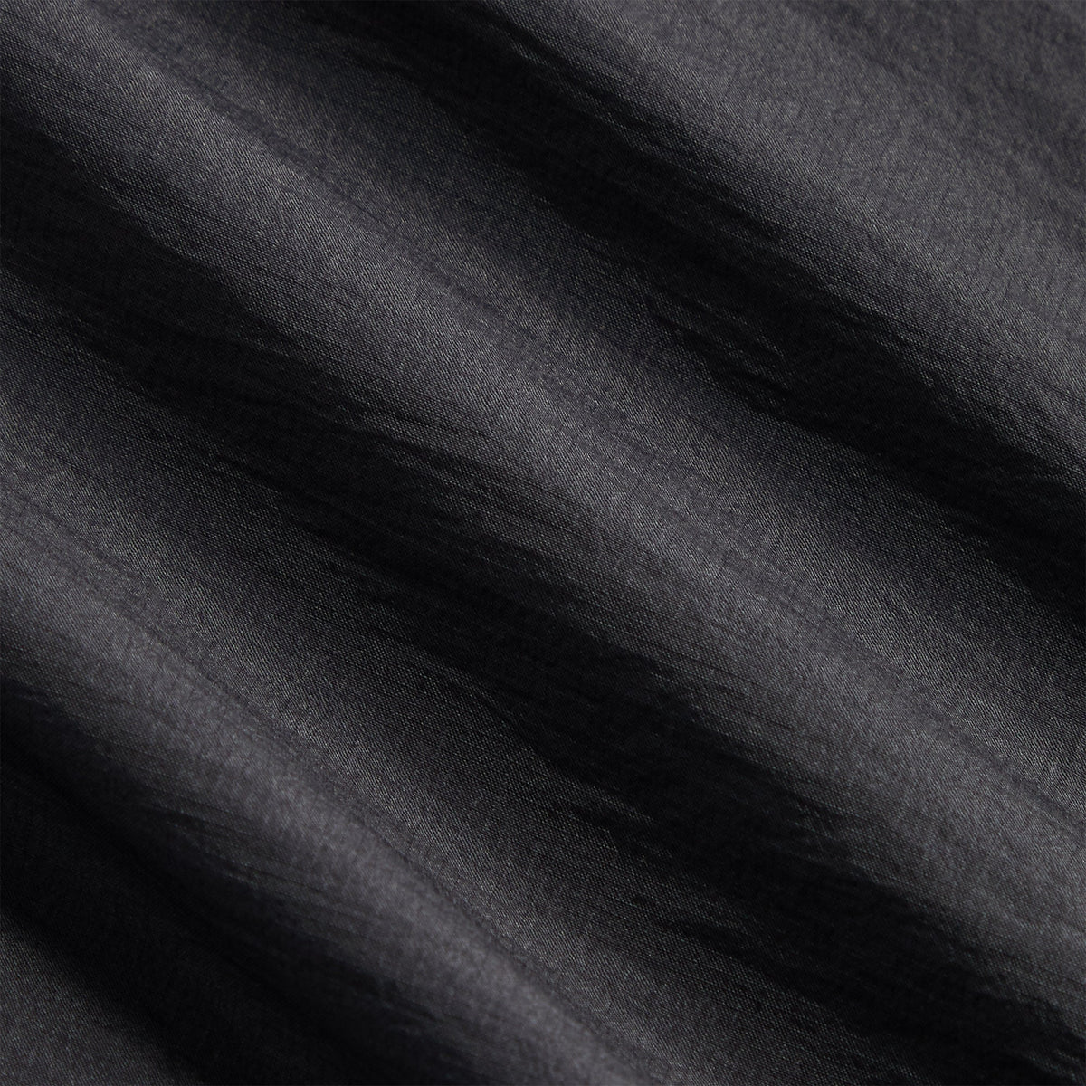 Close-up of Kith Jordan 5-inch Tech Short charcoal ripstop fabric texture