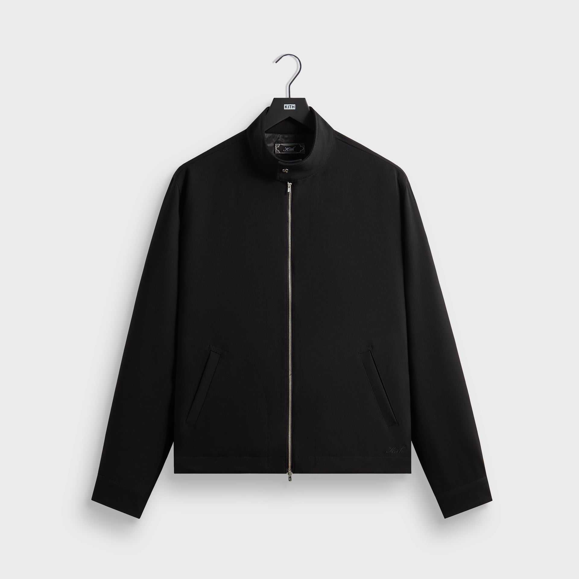 Kith Double Weave Garrison jacket in black with stand collar and zip front, front flat lay