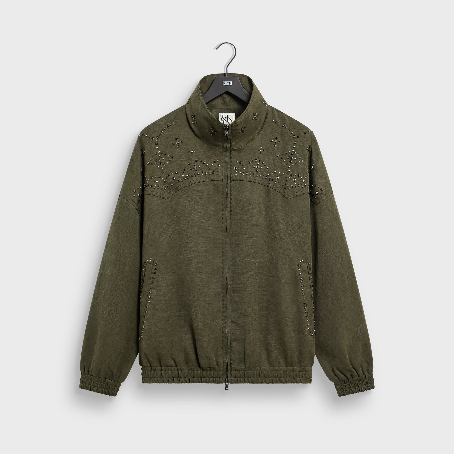 &Kin Studded Canvas Rhysand Jacket in Moss olive, front view on hanger with studded Western yoke and full zip