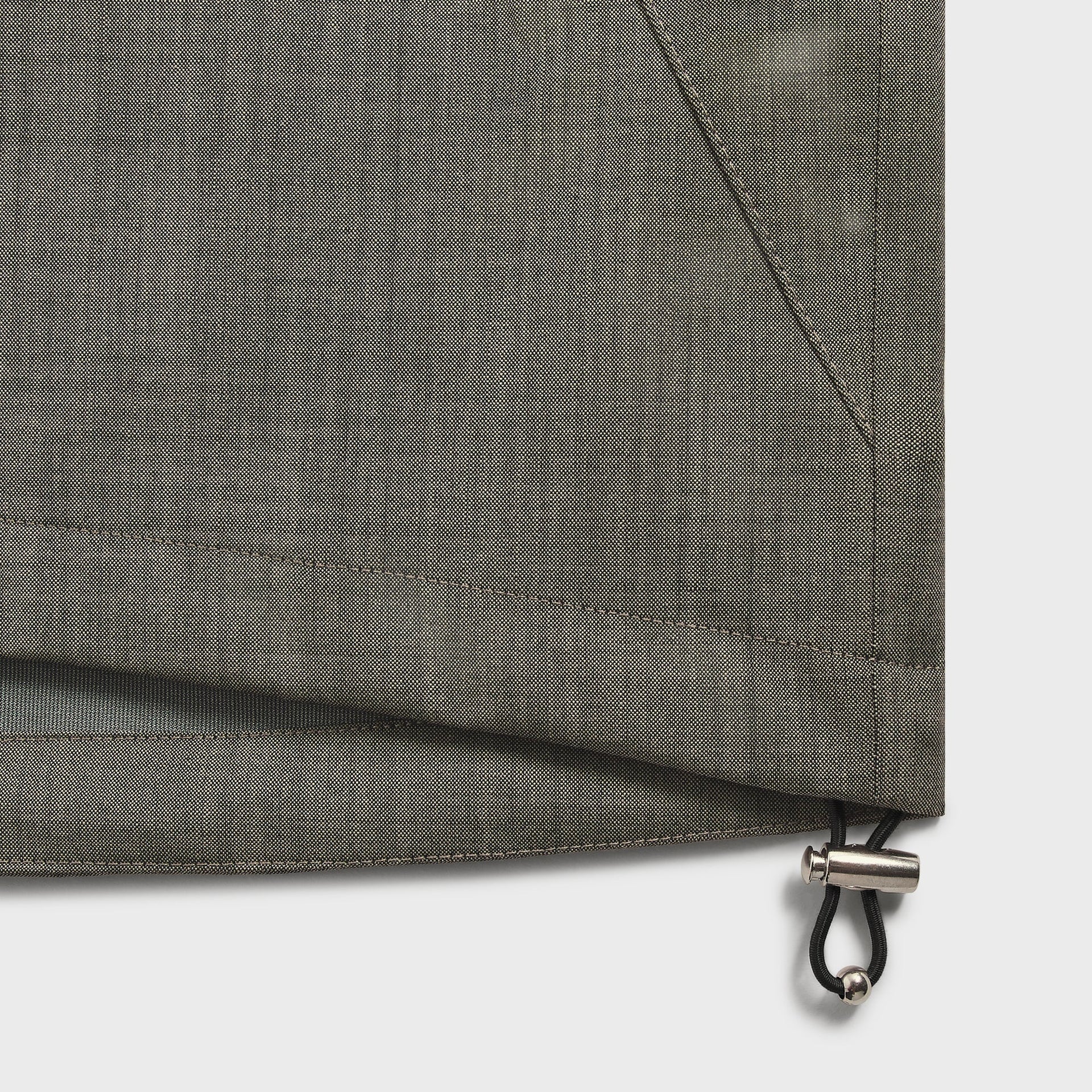 &Kin Tropical Wool Gael Parka hem detail, elastic drawcord toggle and taupe twill wool fabric