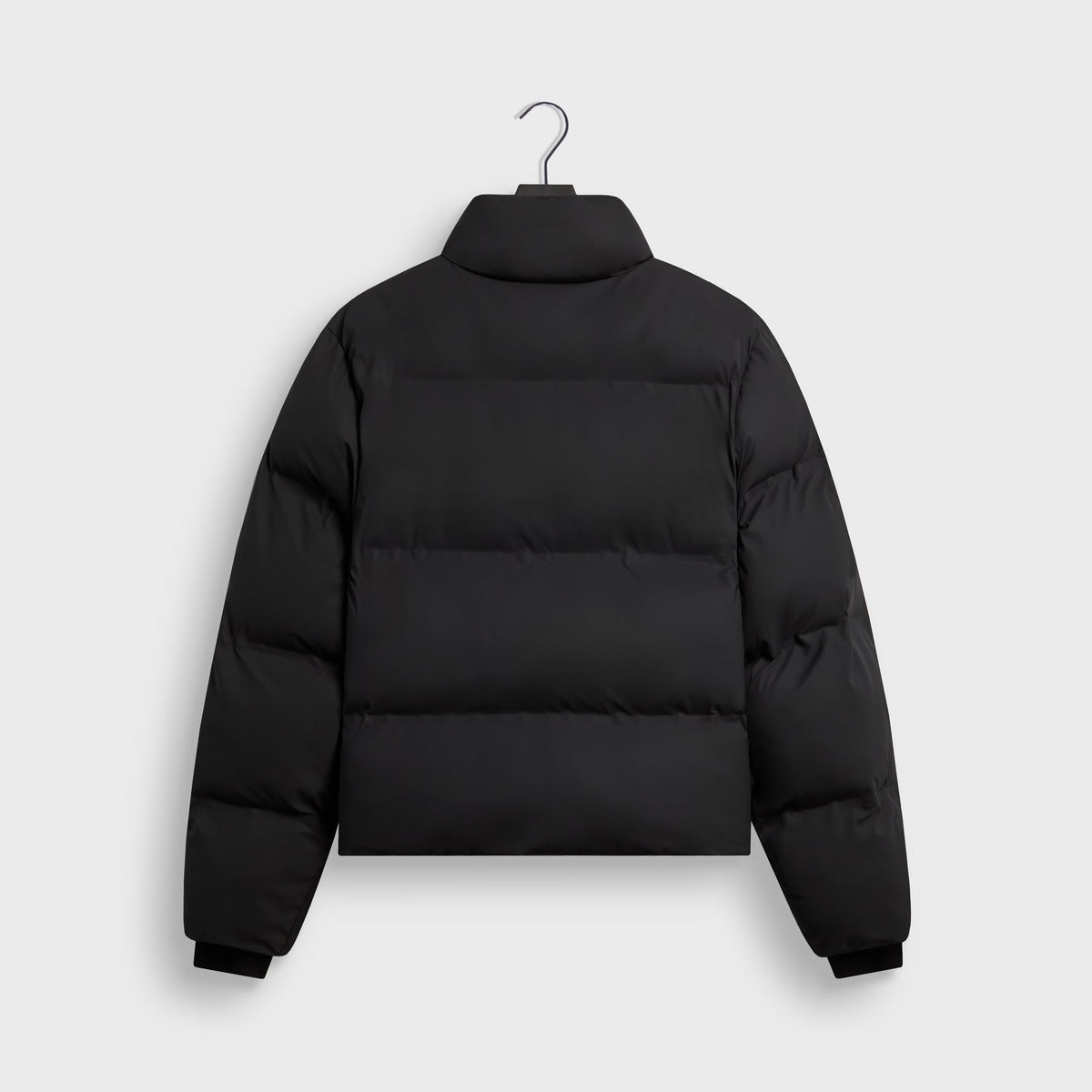Kith Stretch Poly Filmore Puffer in black, back view, with high stand collar