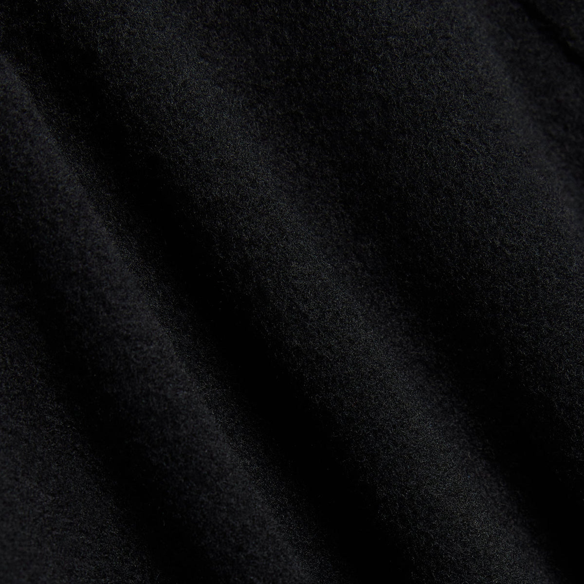 Close-up of black wool cashmere fabric of the &Kin Bowie jacket