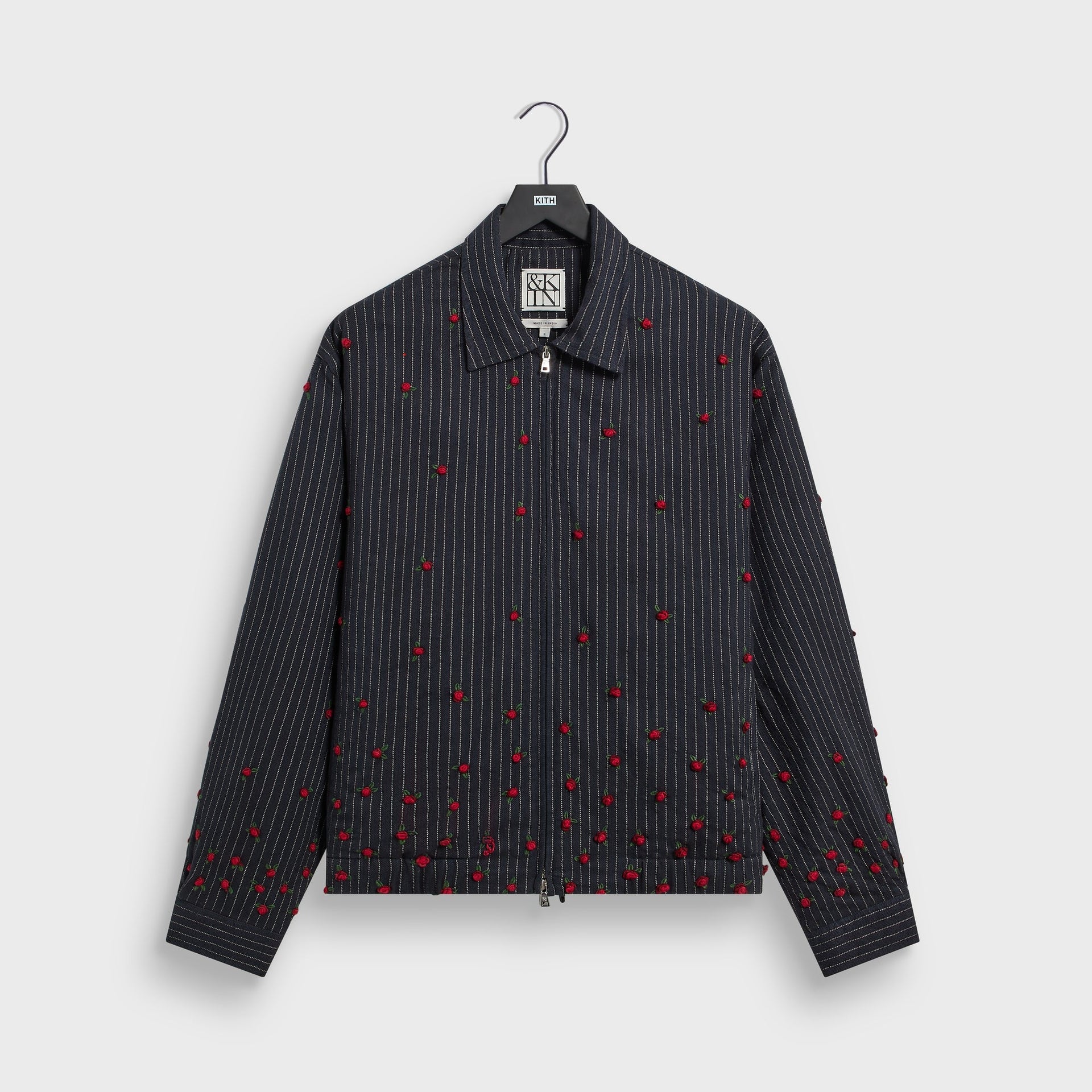 &Kin Embellished Alistair Jacket in Nocturnal navy pinstripe, front view on hanger with red rosebud embroidery, zip front