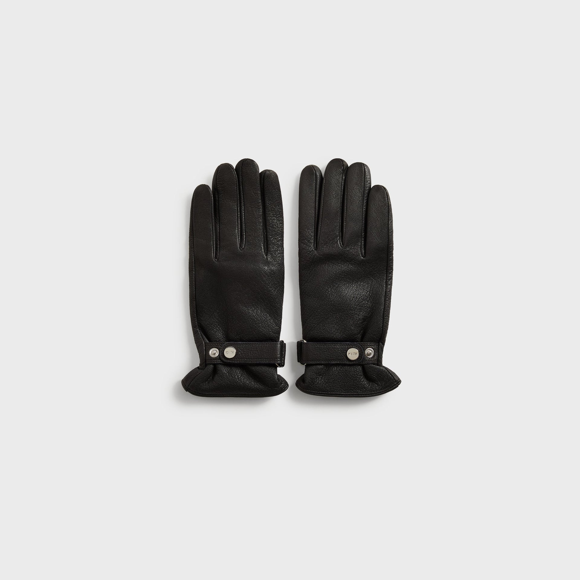 Kith Tumbled Leather Manhattan Gloves in Black, flat lay back-of-hand view with strap and snap closure