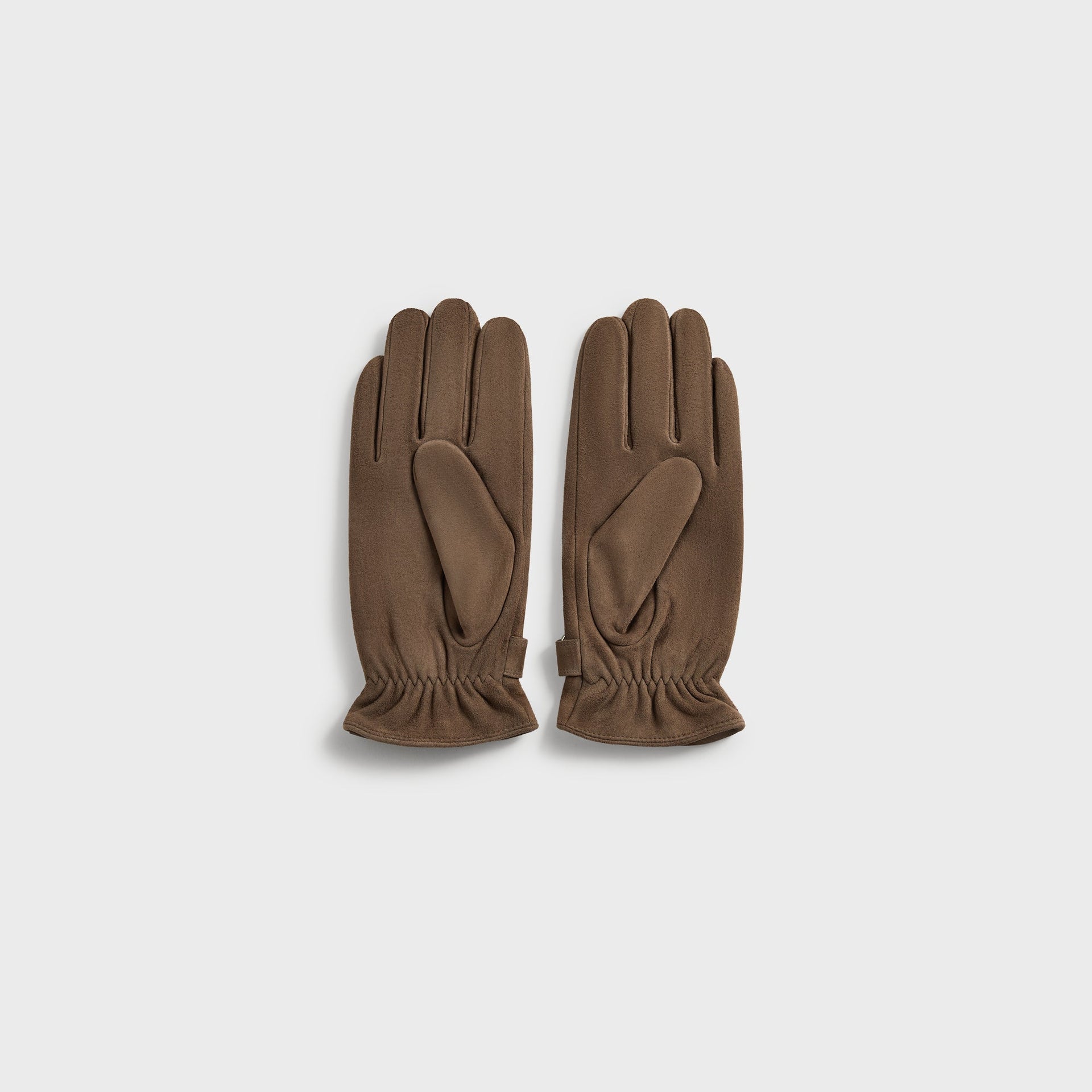 Kith Suede Manhattan Gloves in Java, brown suede pair shown palm side with thumb and strap detail