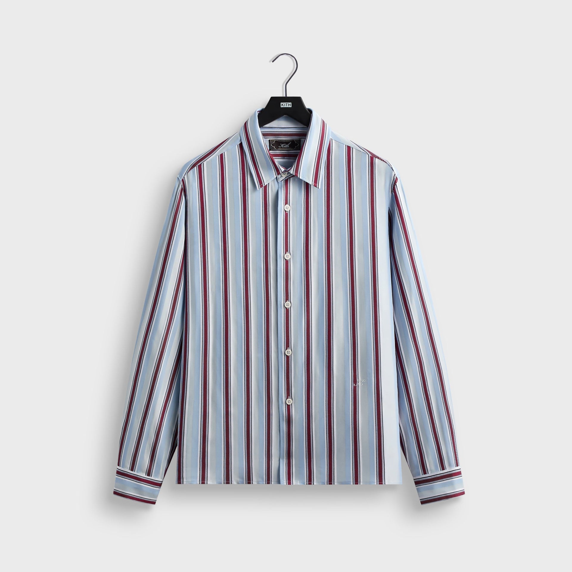 Kith Striped Jacquard Thompson shirt in tin with blue, red and white multi-stripe pattern, front flat lay