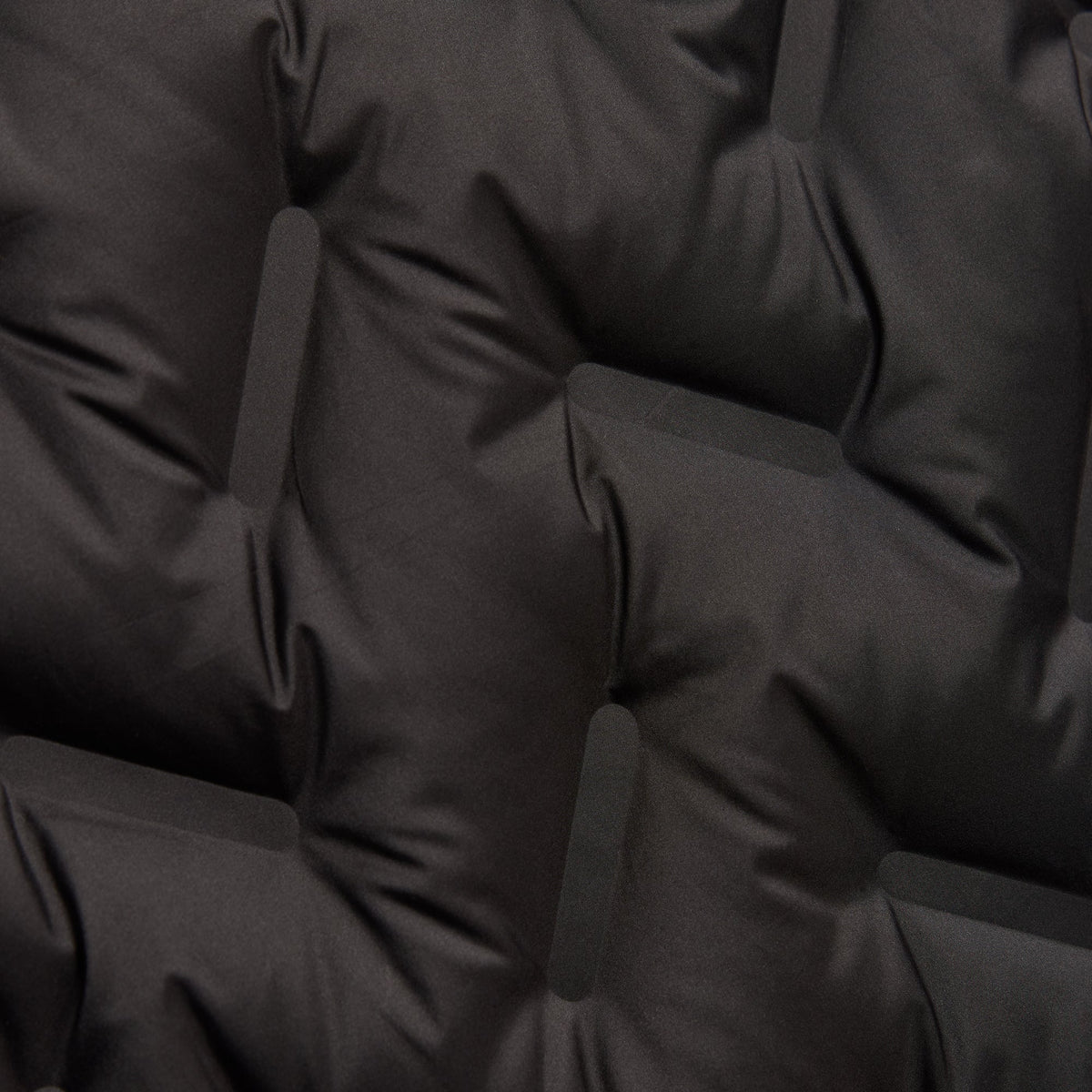 Close-up of the chevron-quilted nylon and denim fabric of the Kith Gertie shirt