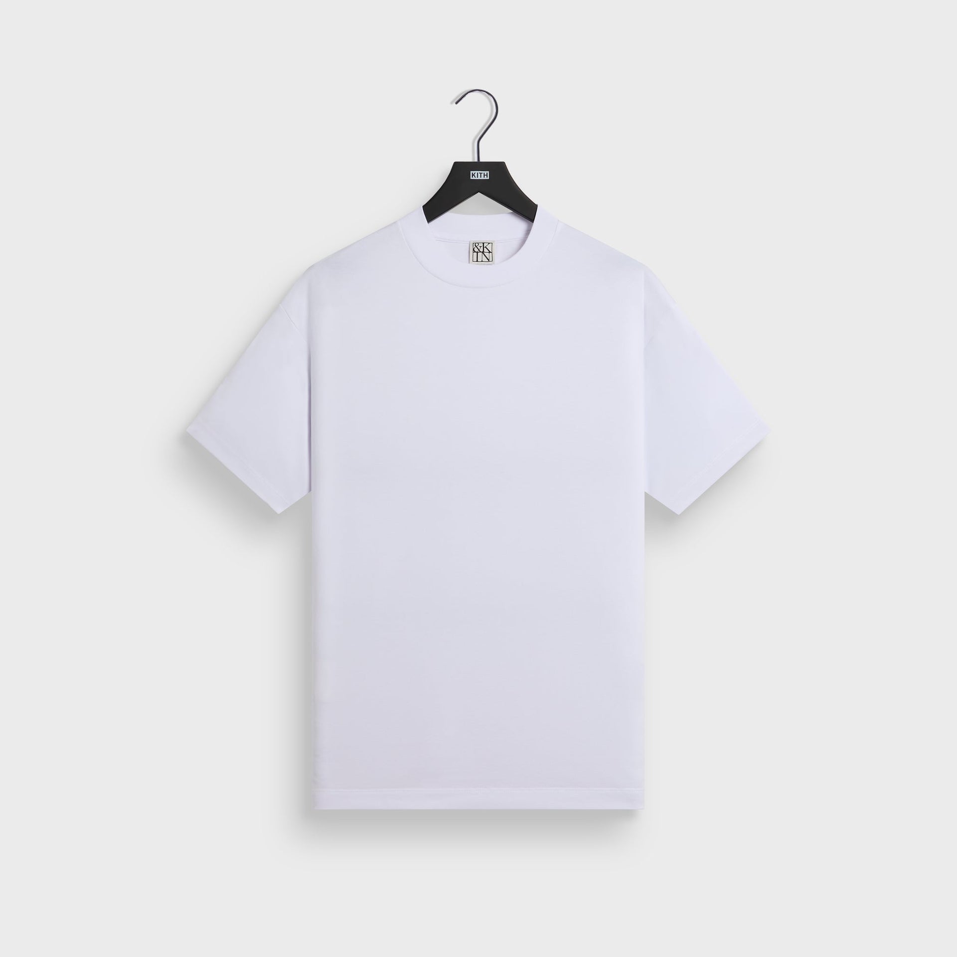 &Kin Mock Neck Albie Tee in white, front view on KITH hanger, short sleeves
