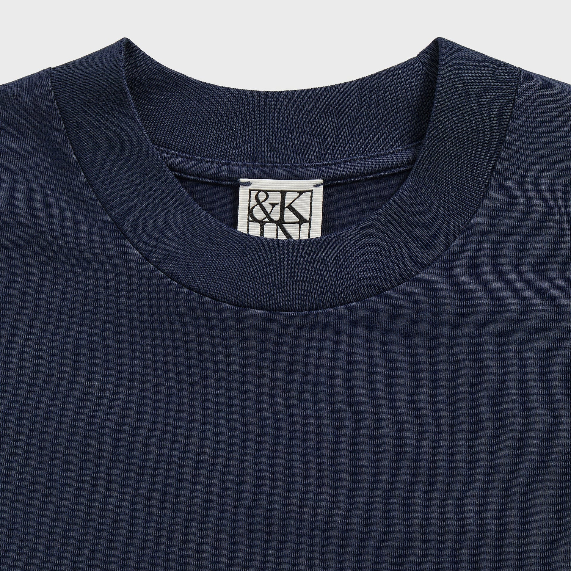 &Kin Mock Neck Albie Tee detail: ribbed mock collar with woven &Kin label in Nocturnal navy