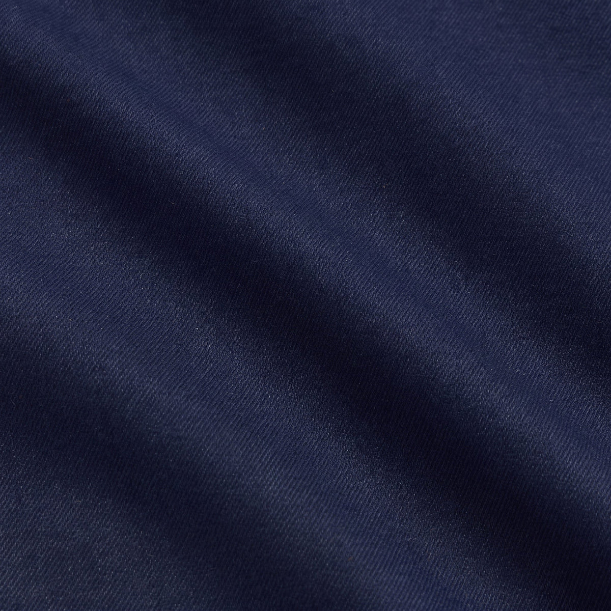 Close-up of navy flannel fabric texture on the Deon overshirt