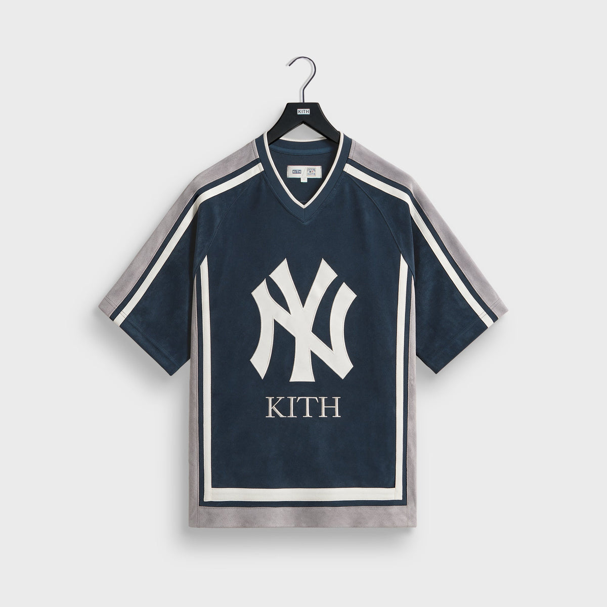 Navy Kith for New York Yankees Derek Jeter Leon jersey shirt with grey racing stripes and NY Kith logo, front flat lay