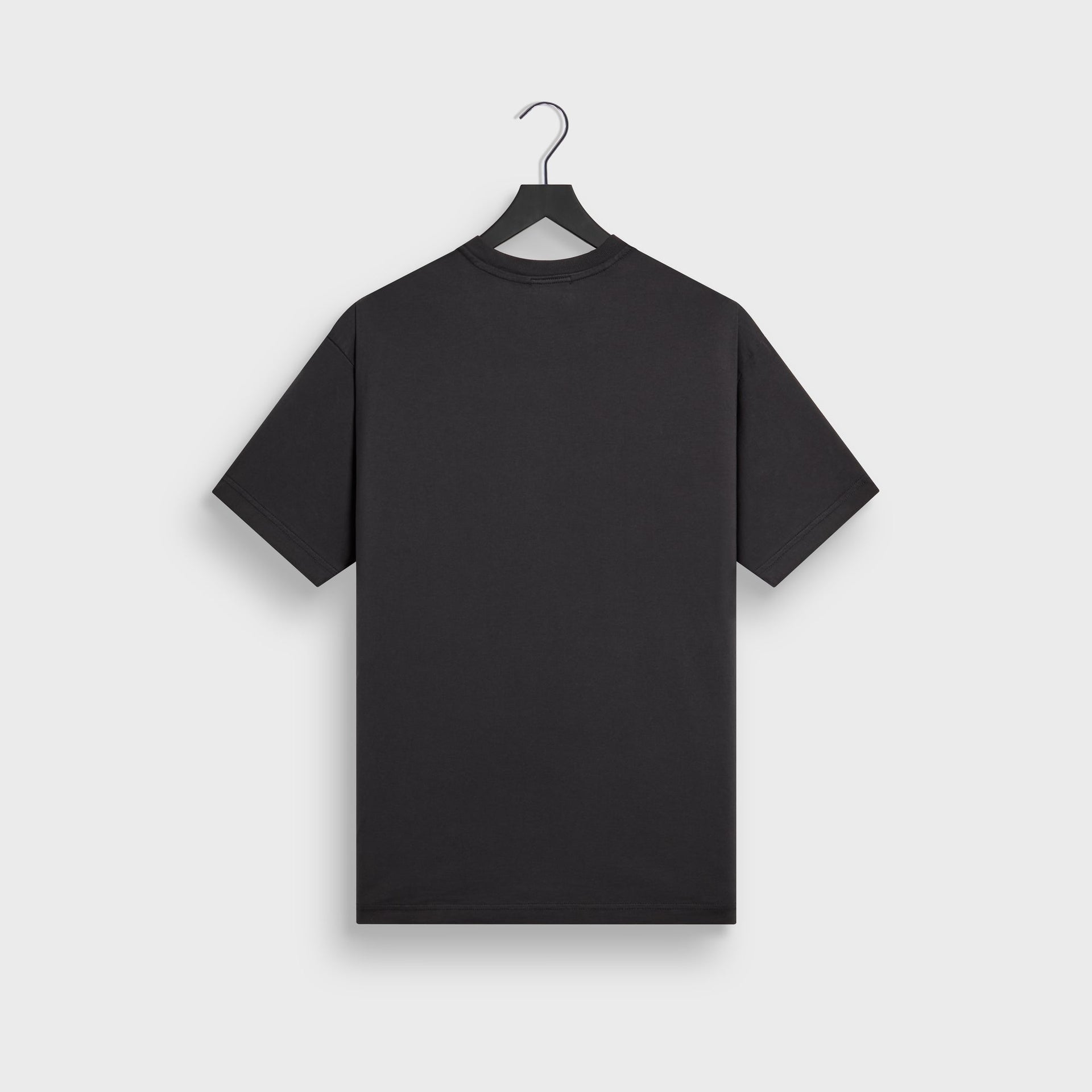 Kith LAX tee in black cotton, back flat lay on hanger